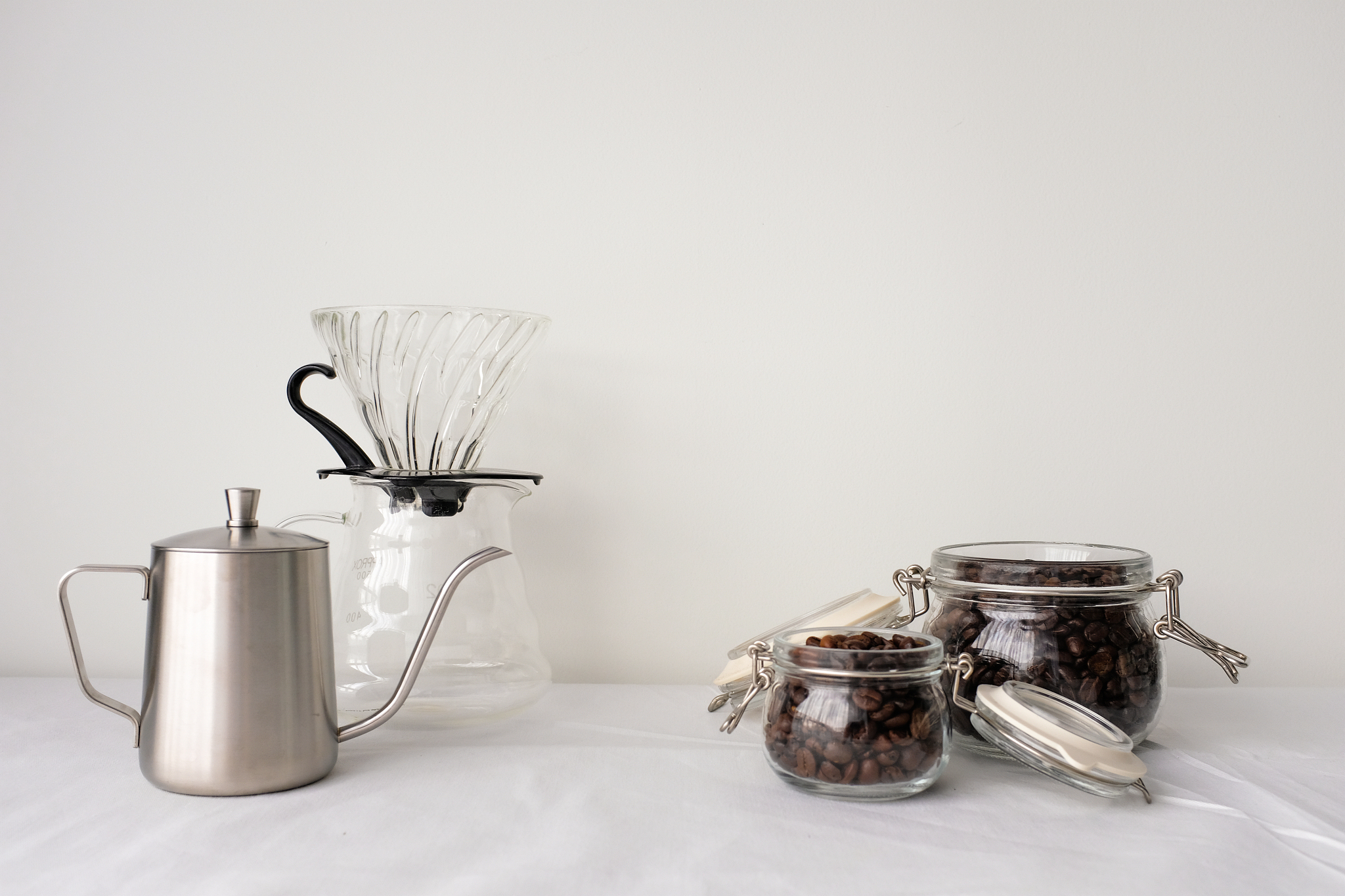 close-up of glass utensils against white background