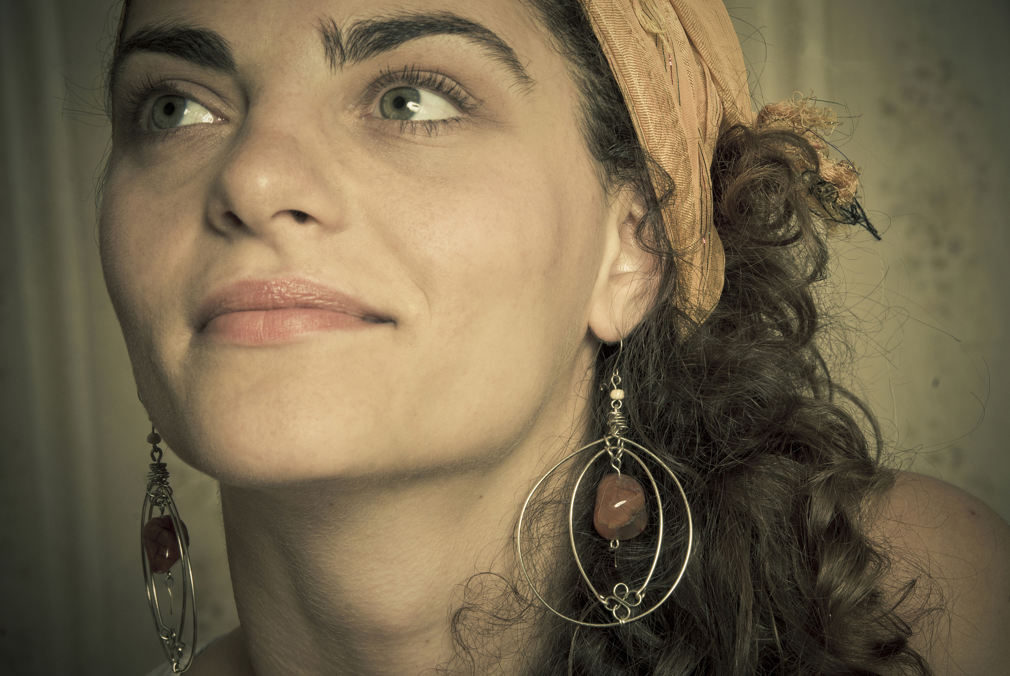close-up of young woman smiling and looking up