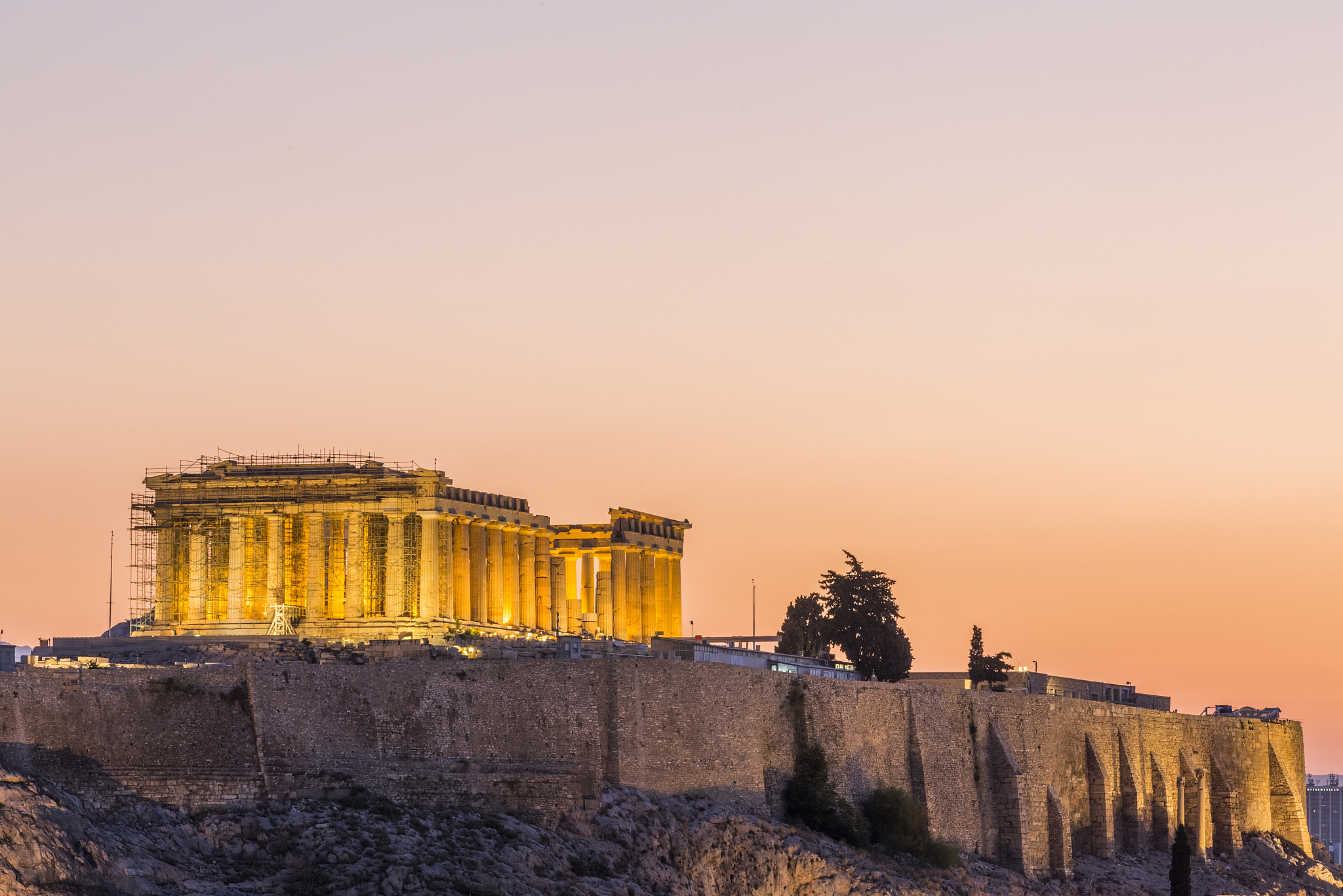 the acropolis of athens at sunrise, seen from the hill of the mu