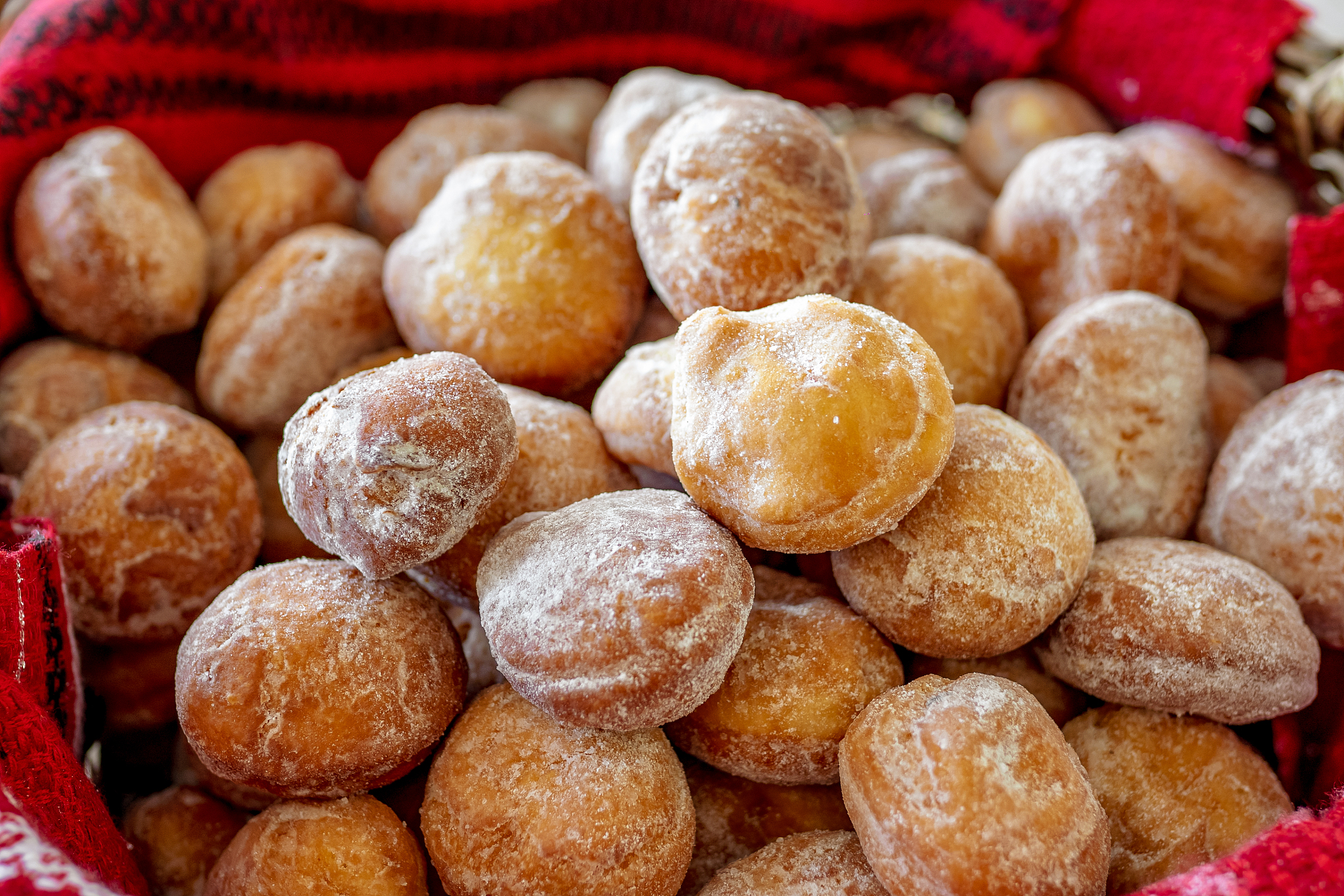 homemade romanian doughnuts in a basket