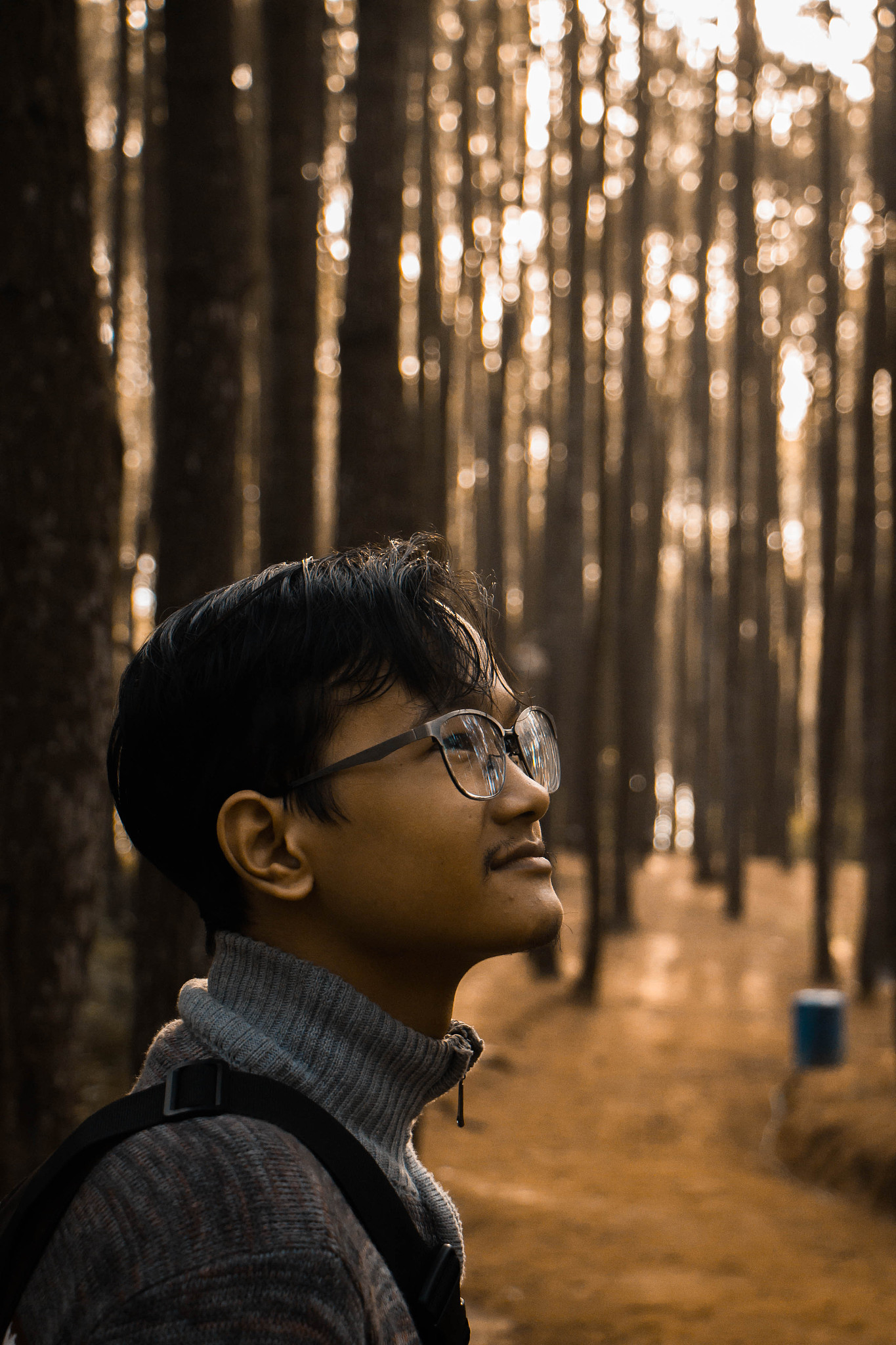 portrait of young man in forest