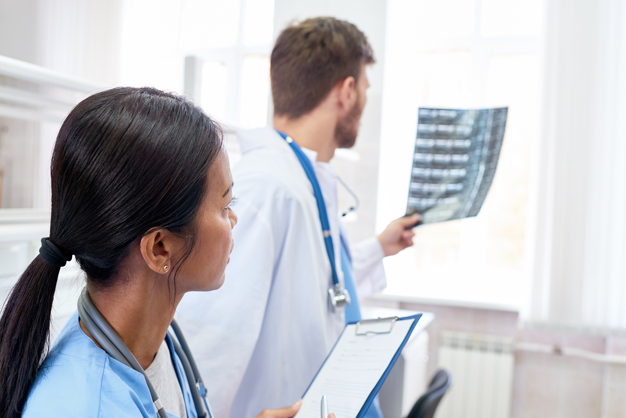 doctor examining x-ray