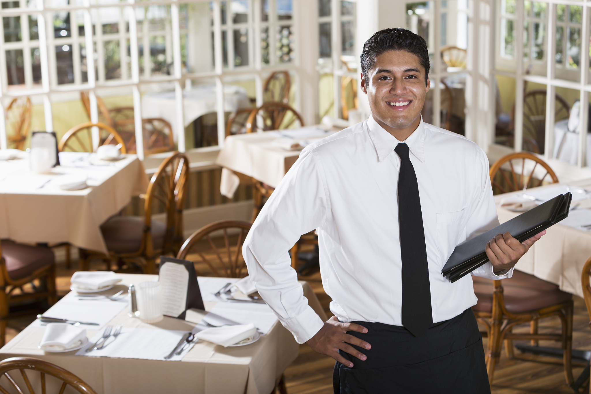 waiter holding menus