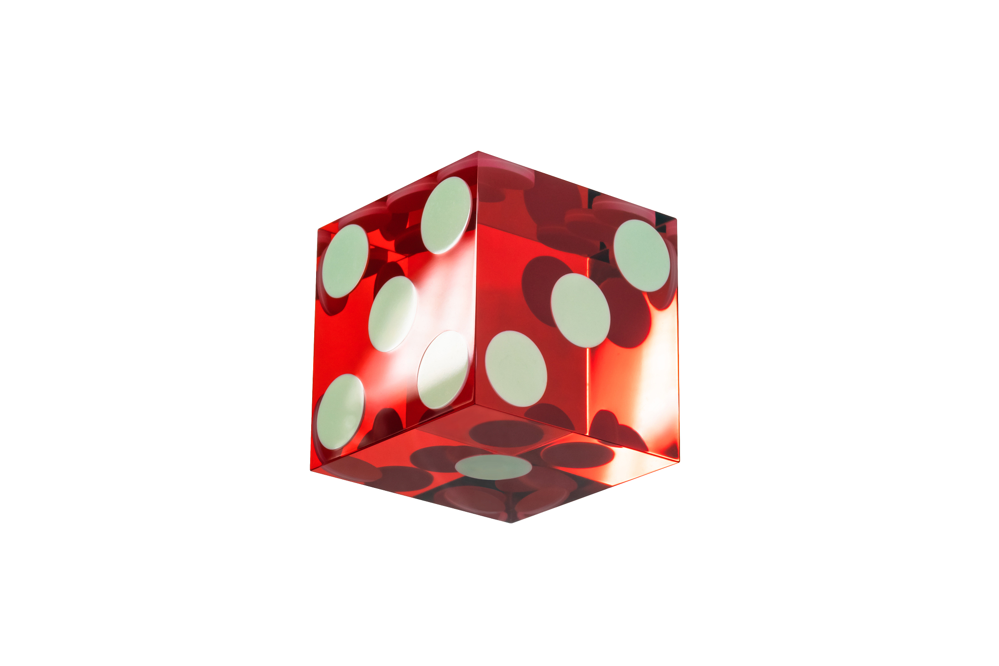 one dice red glass with sharp edges and a light flare, isolated 
