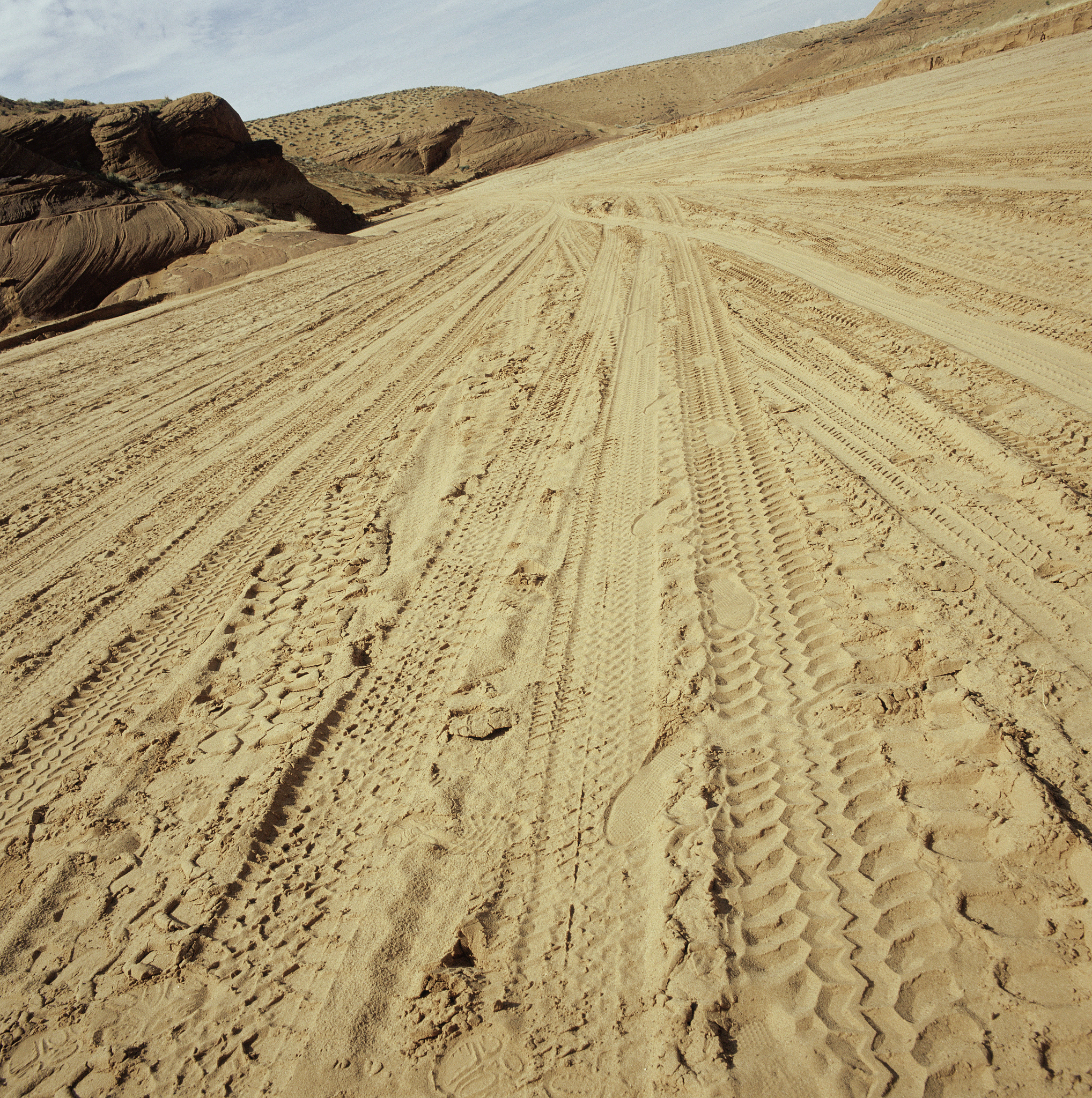 detail view of tyre tracks in sand dunes