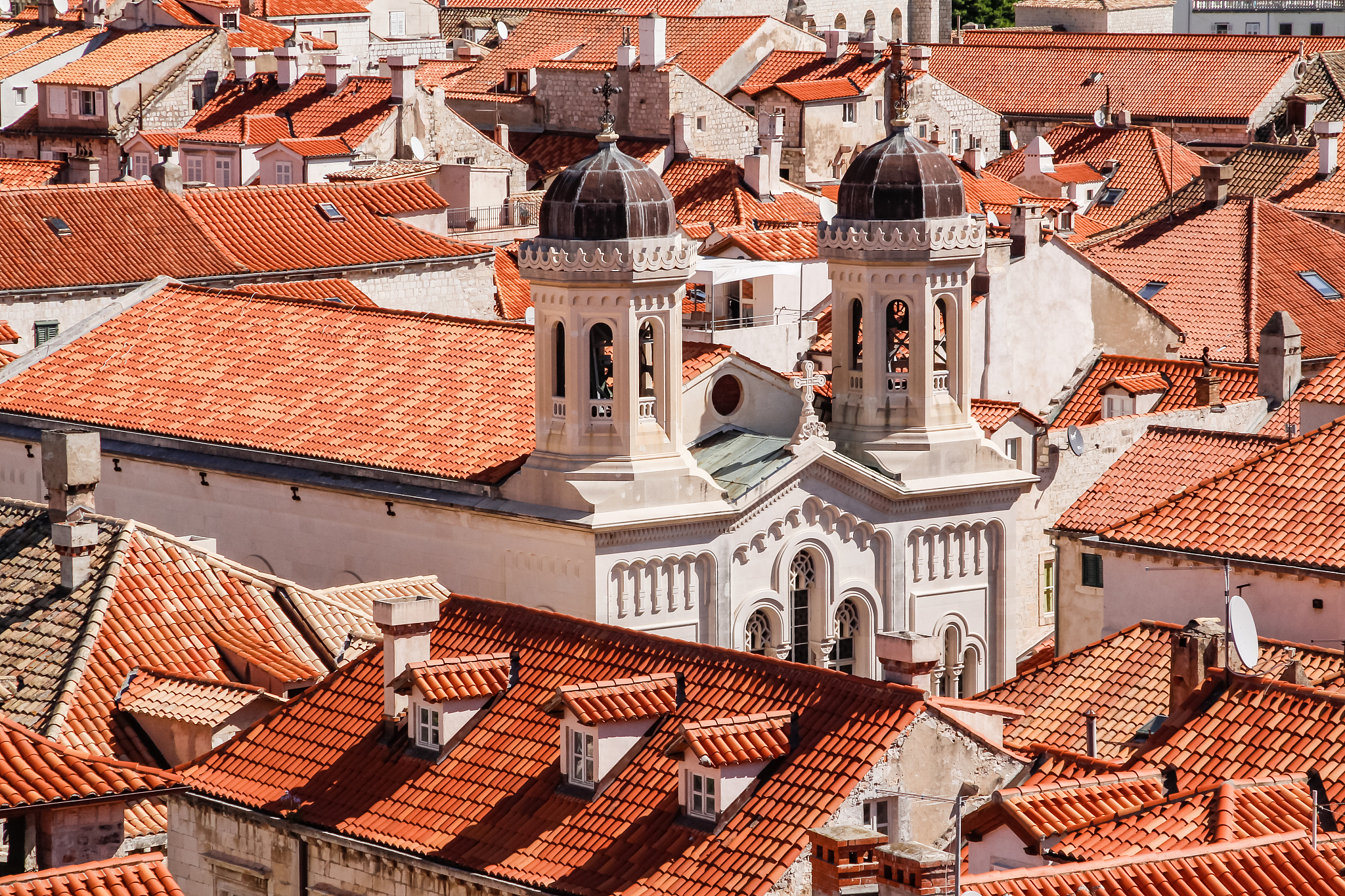 church among red terra cotta tile roofs in the old town of dubro