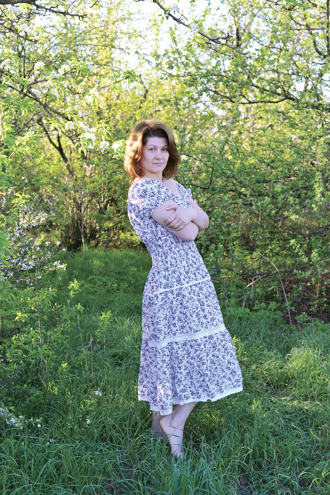 woman in  apple orchard at  early spring