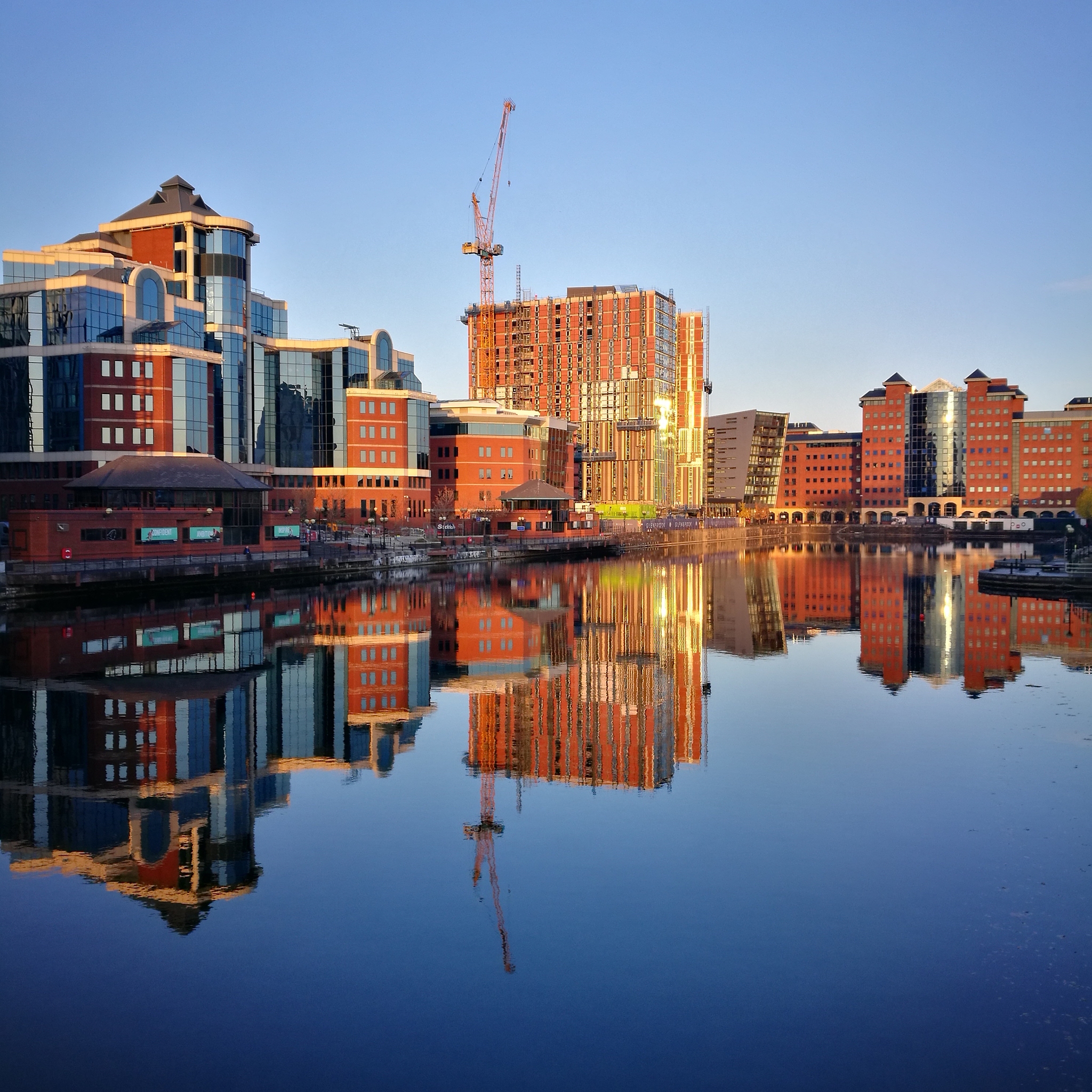 reflection of buildings in city against sky