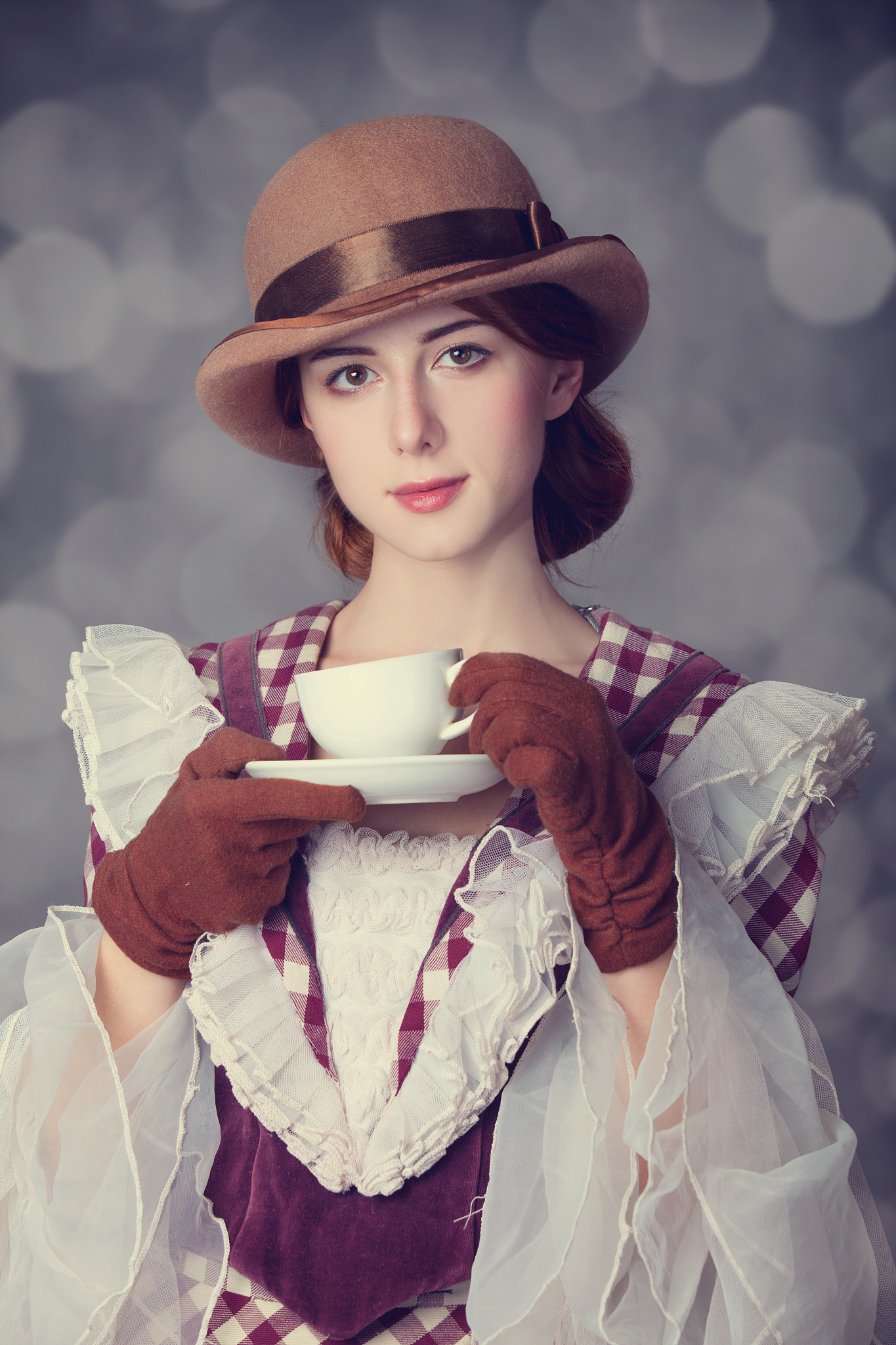 beautiful redhead women with cup of tea.
