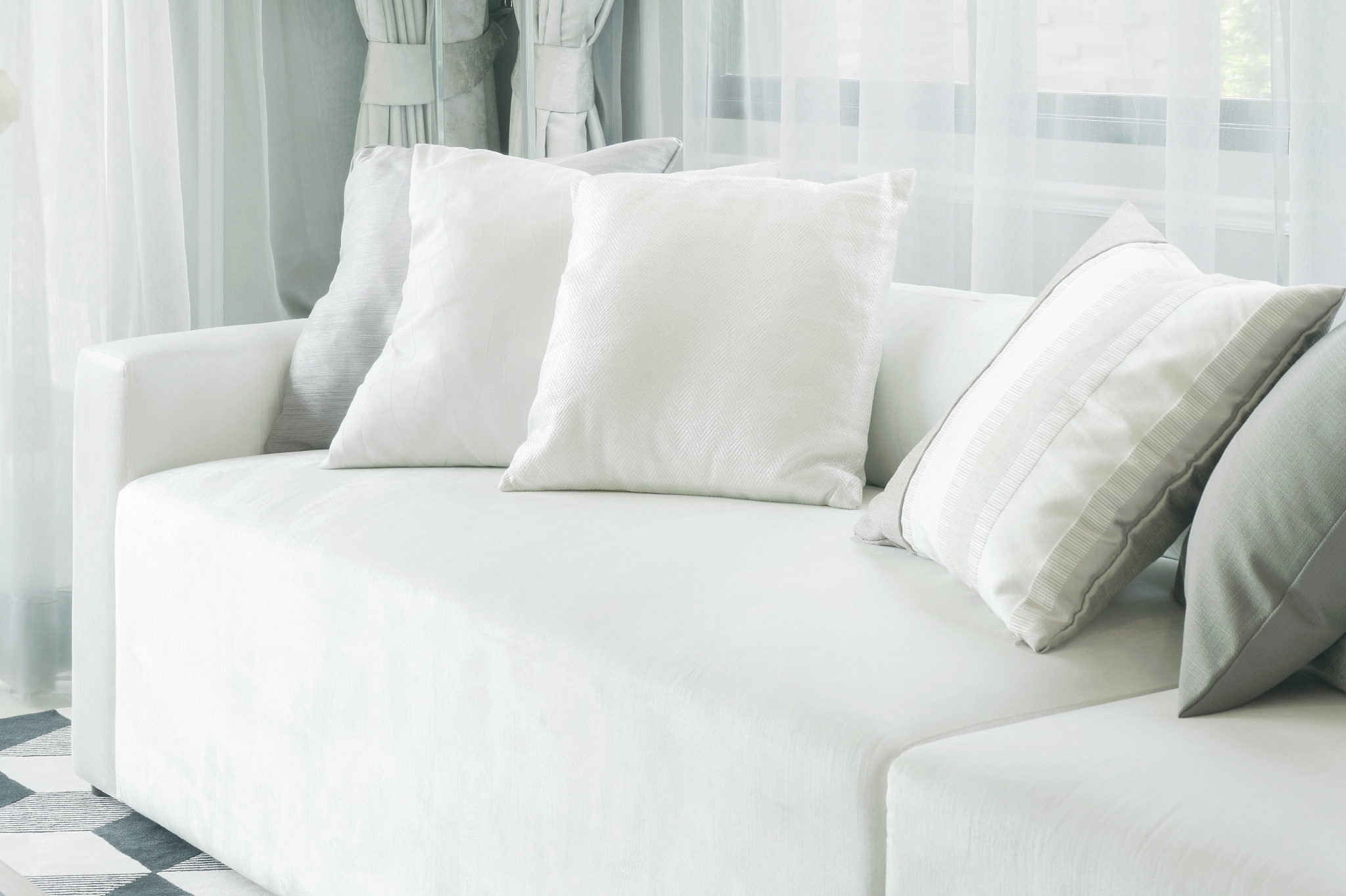 white pillows lay on sofa in modern style living room