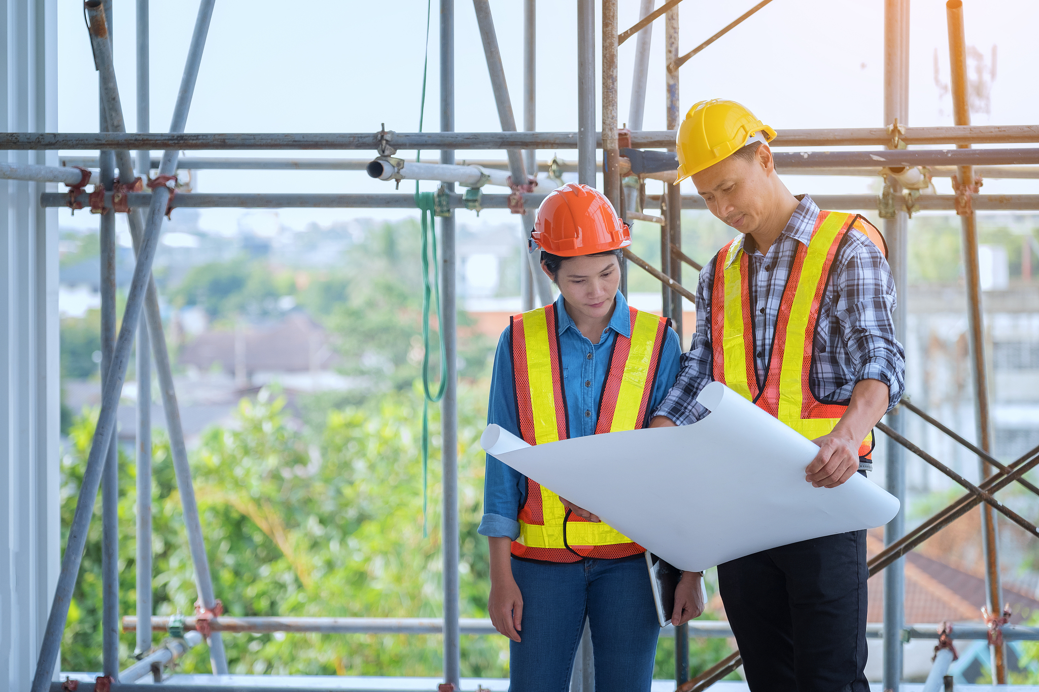 engineers are meeting, working and looking at home blueprint in 