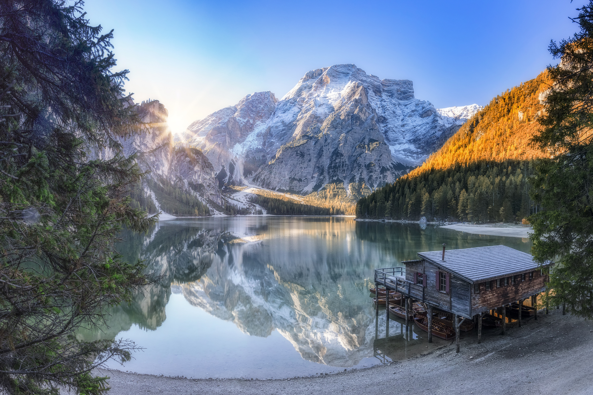 boathouse at sunrise at unesco world heritage lake braies