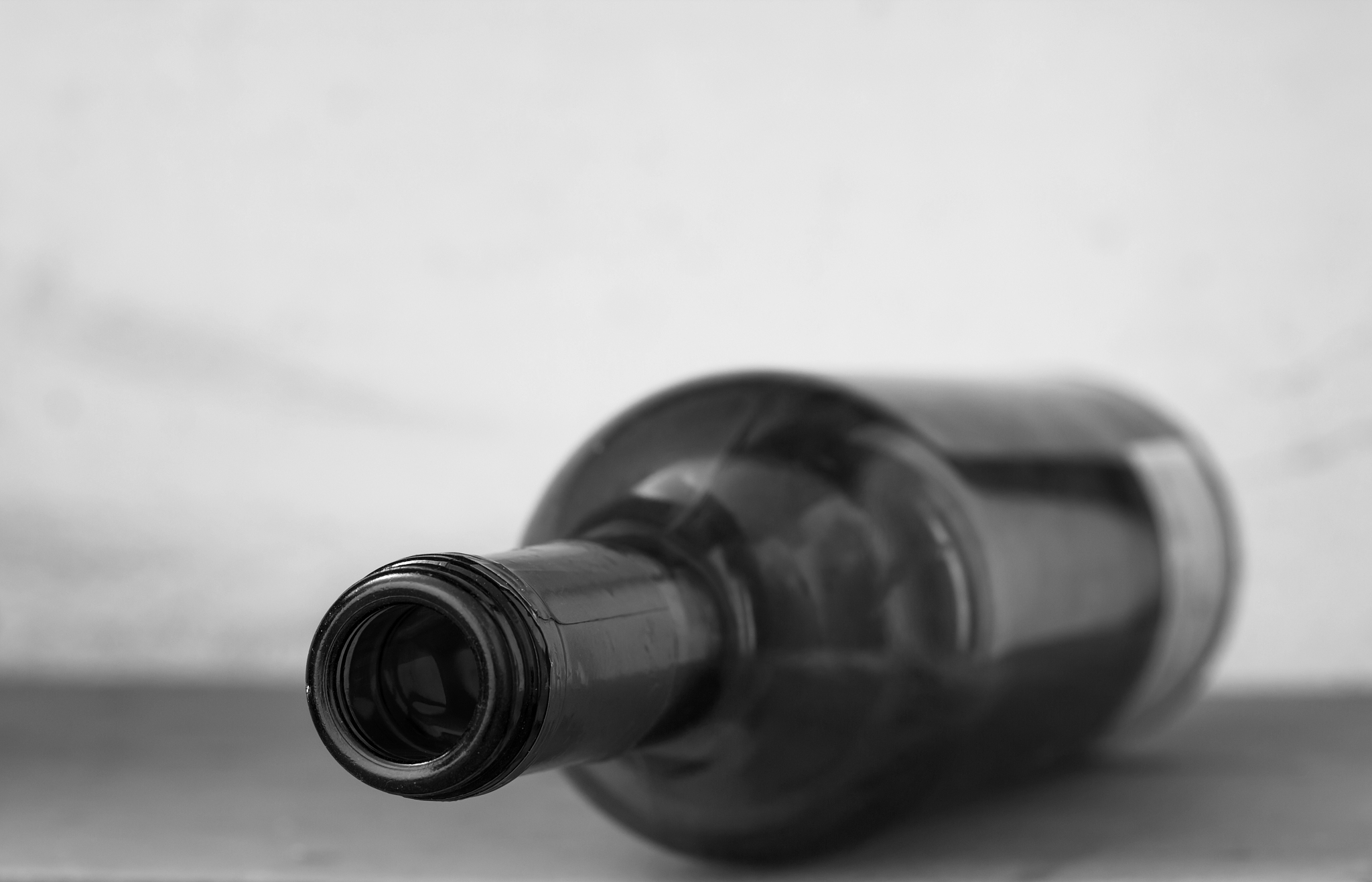 close-up of empty glass bottle of wine
