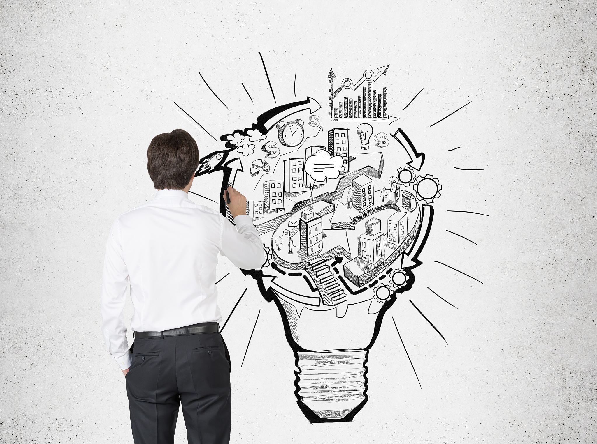 businessman drawing a light bulb city