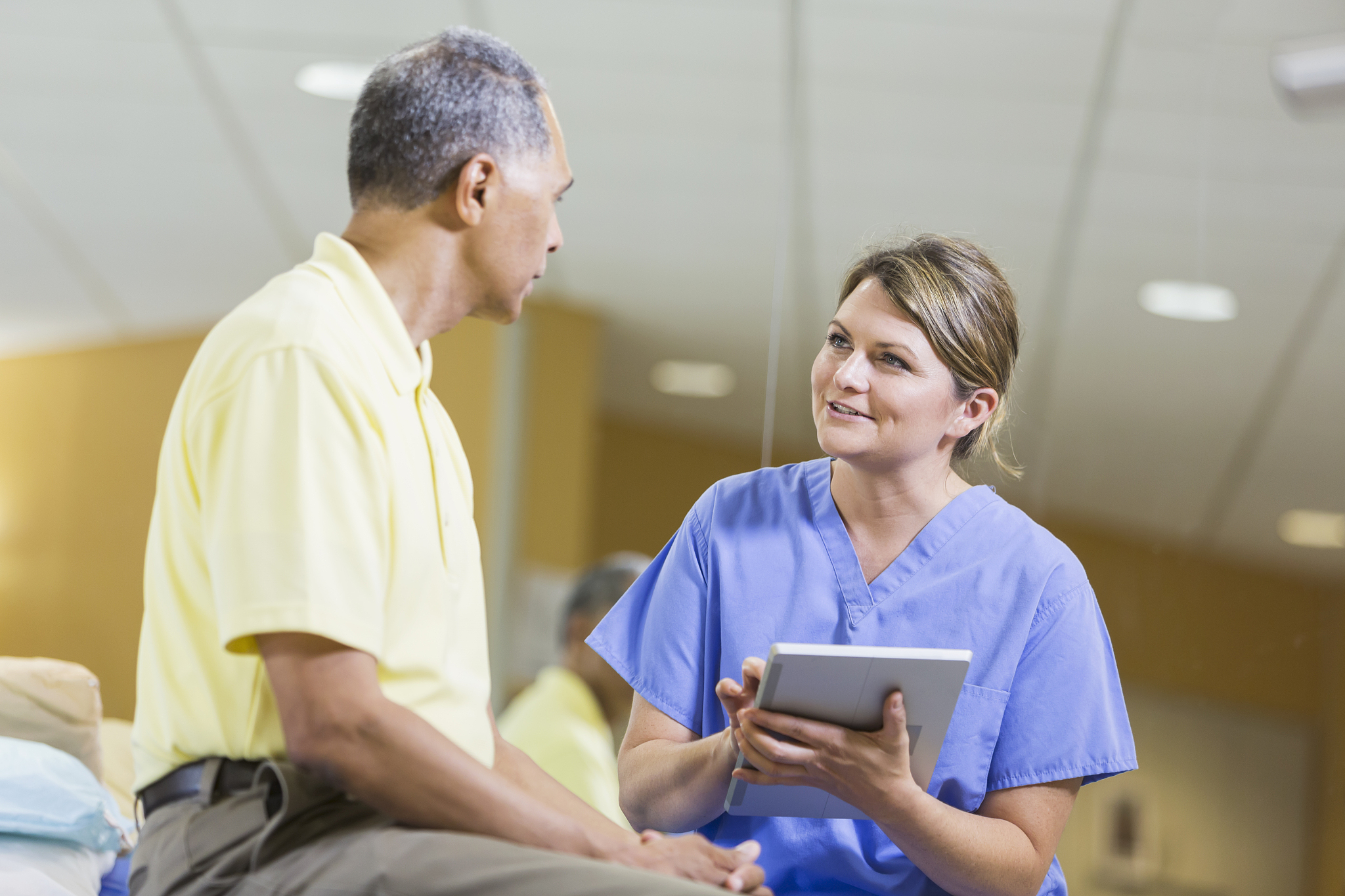 female physical therapist, african american patient