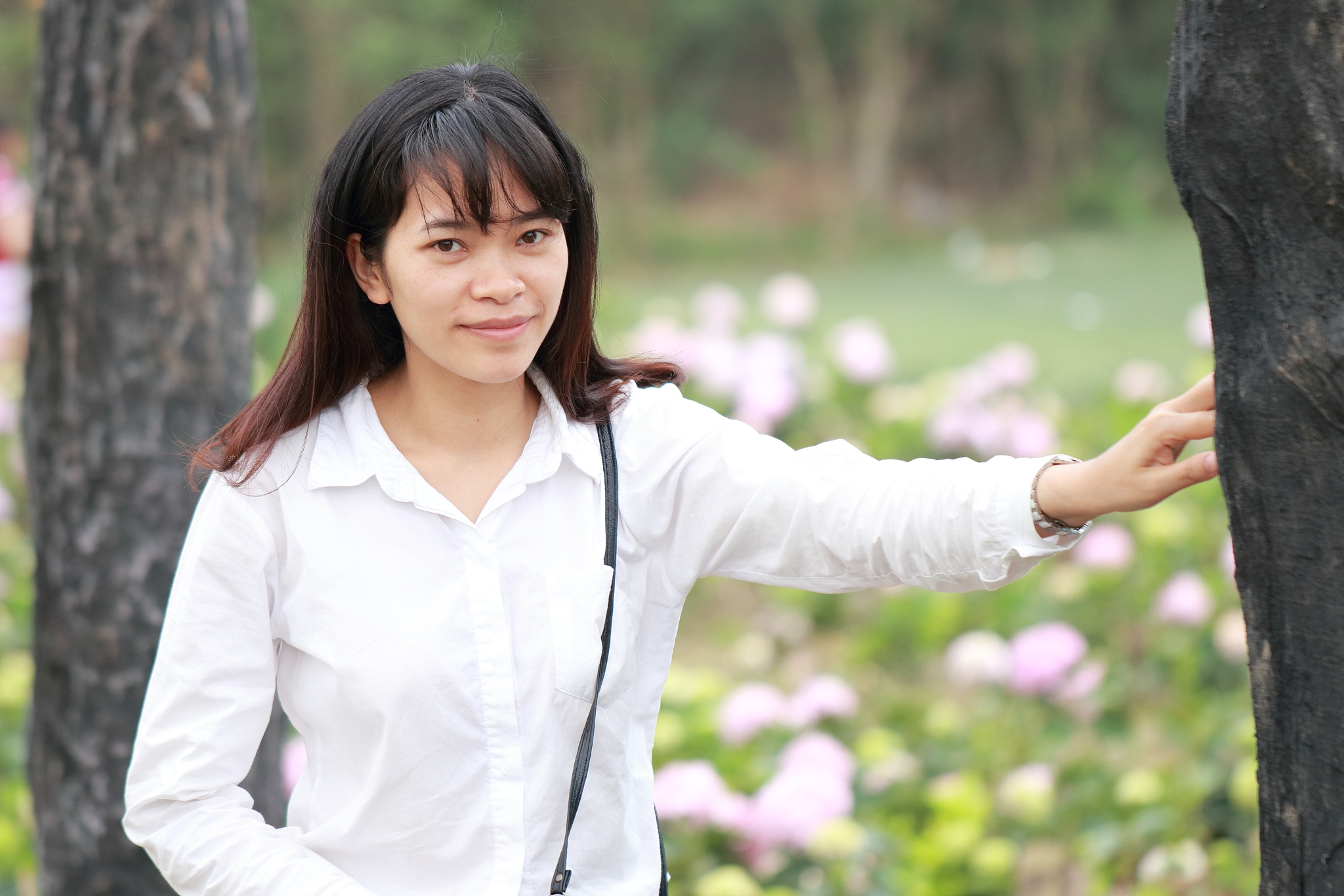 woman at the flower garden in hanoi, vietnam