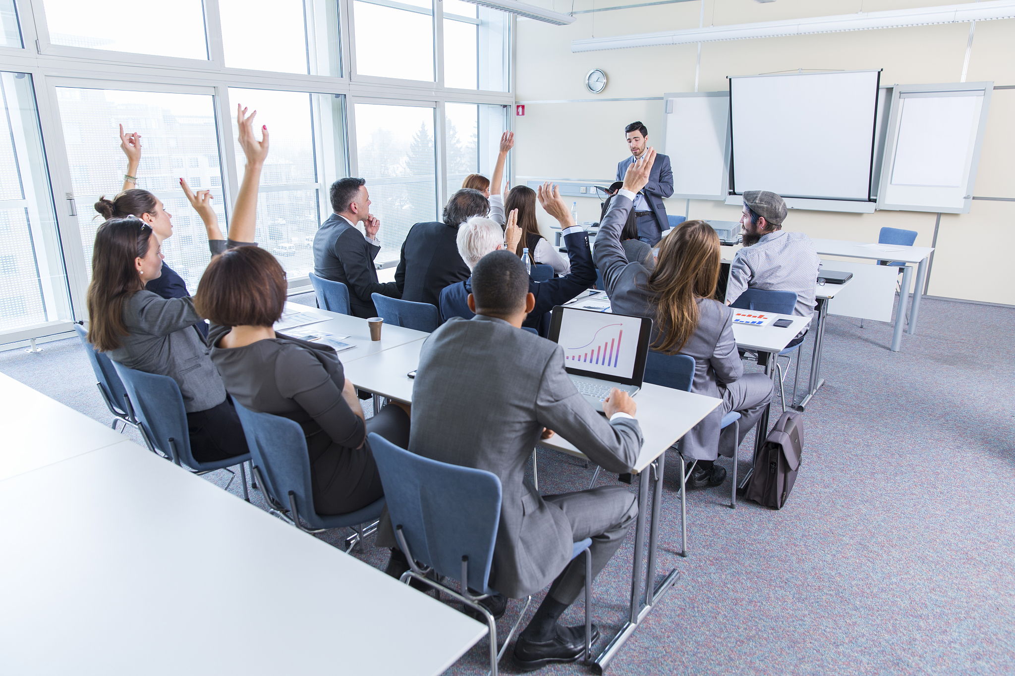business people in a classroom listening lecturer