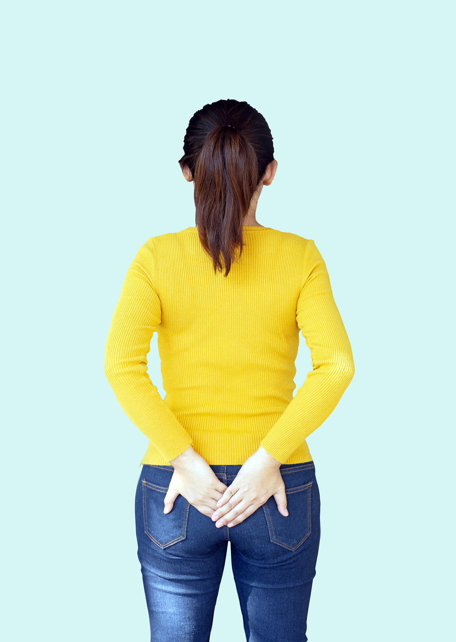 woman hold her bum as pain in hemorrhoids backside