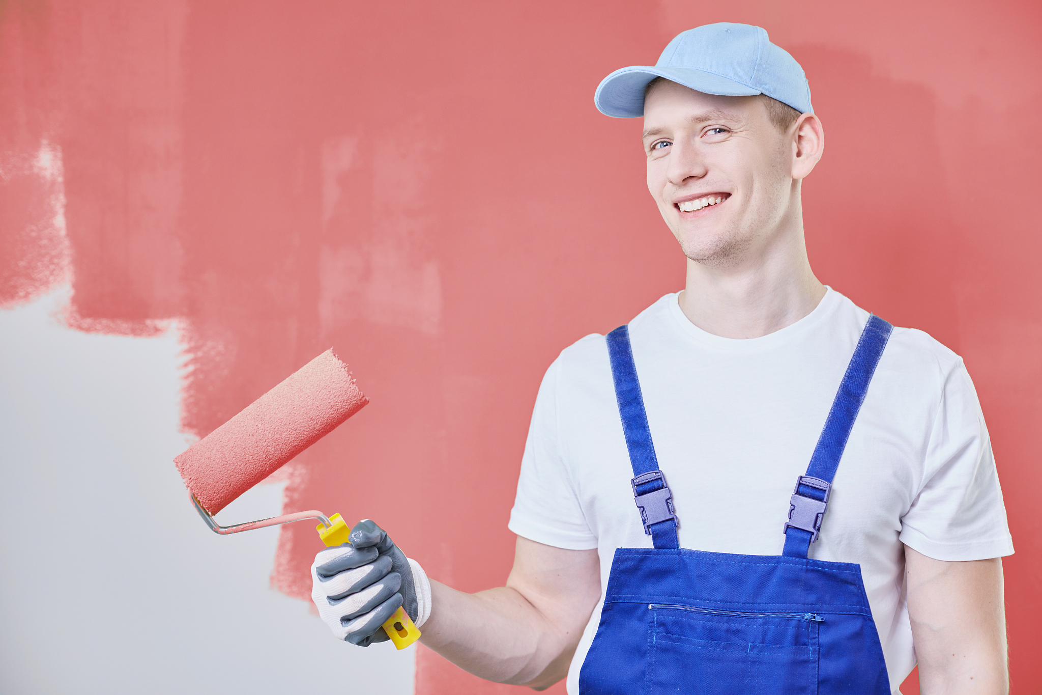 painter wearing cap and overalls