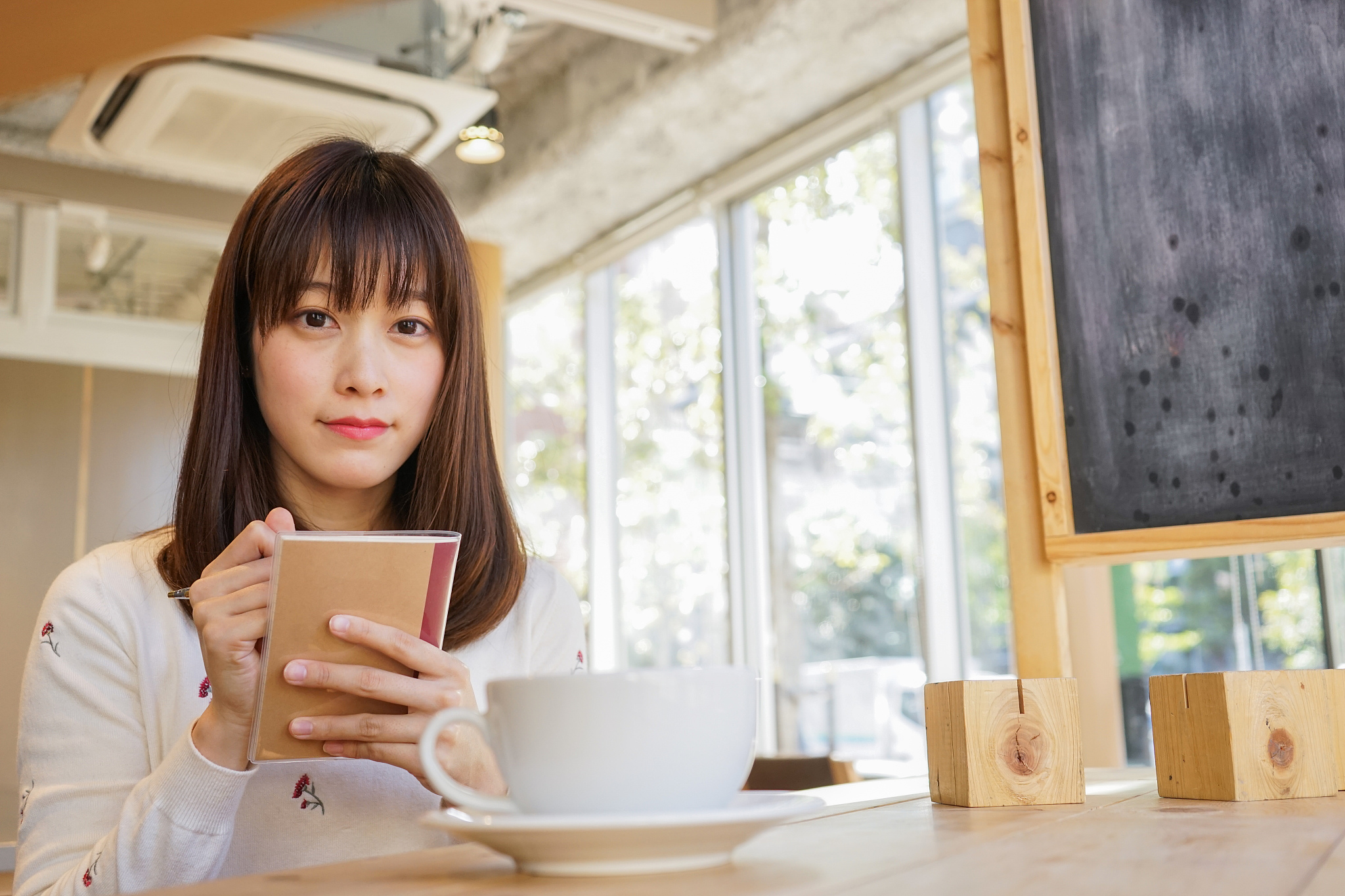 young woman working at café