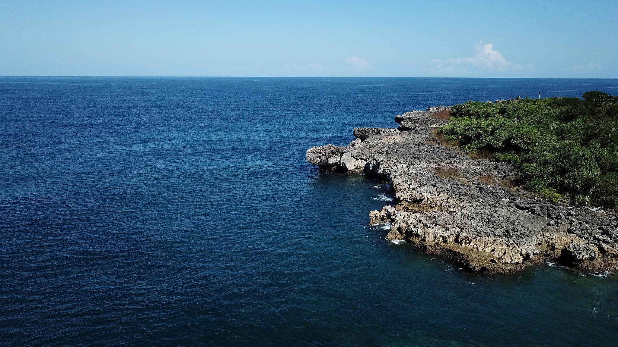aerial view of rocky cliffside seashore in nusa dua bali,indones
