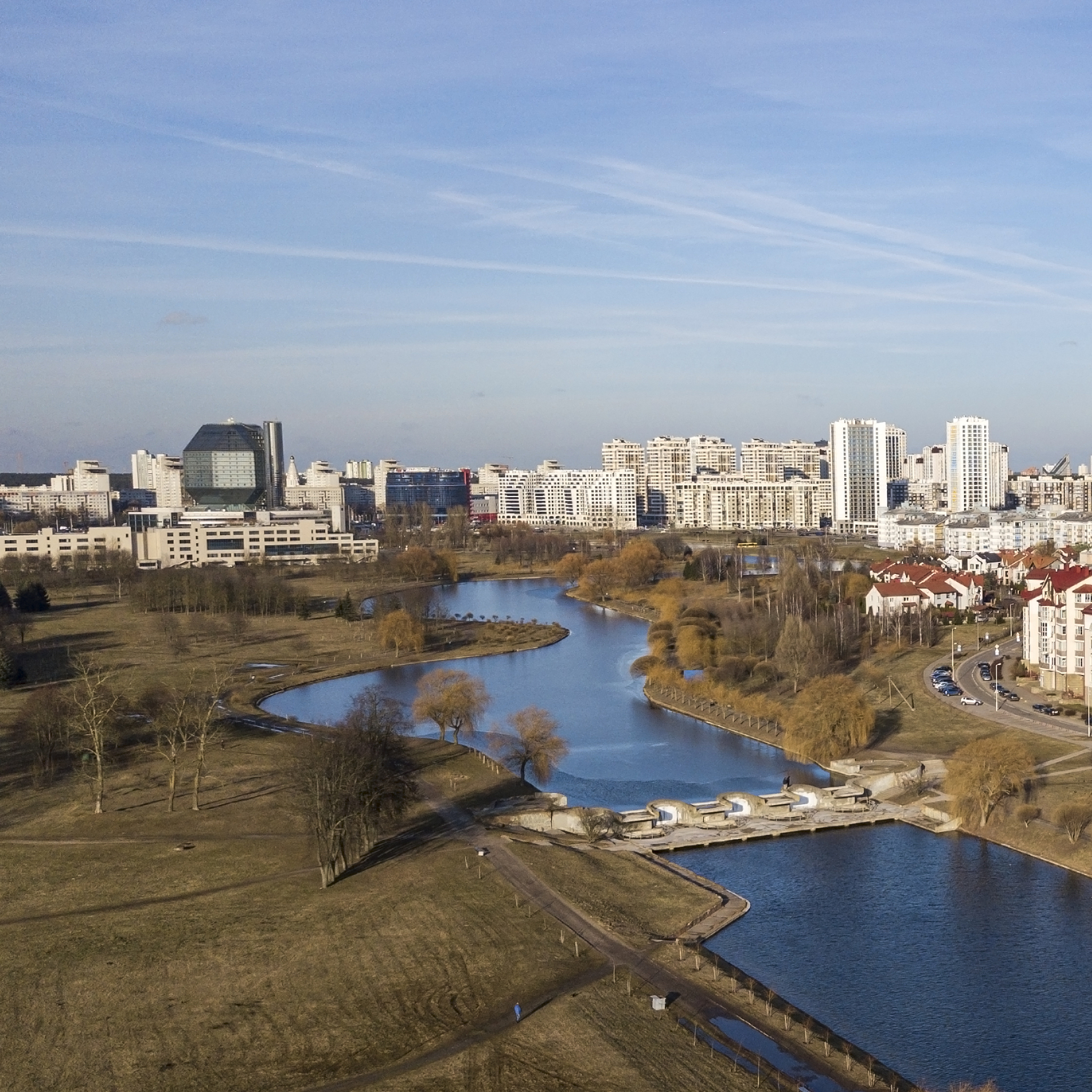 areal view of residential housing area and water channel.