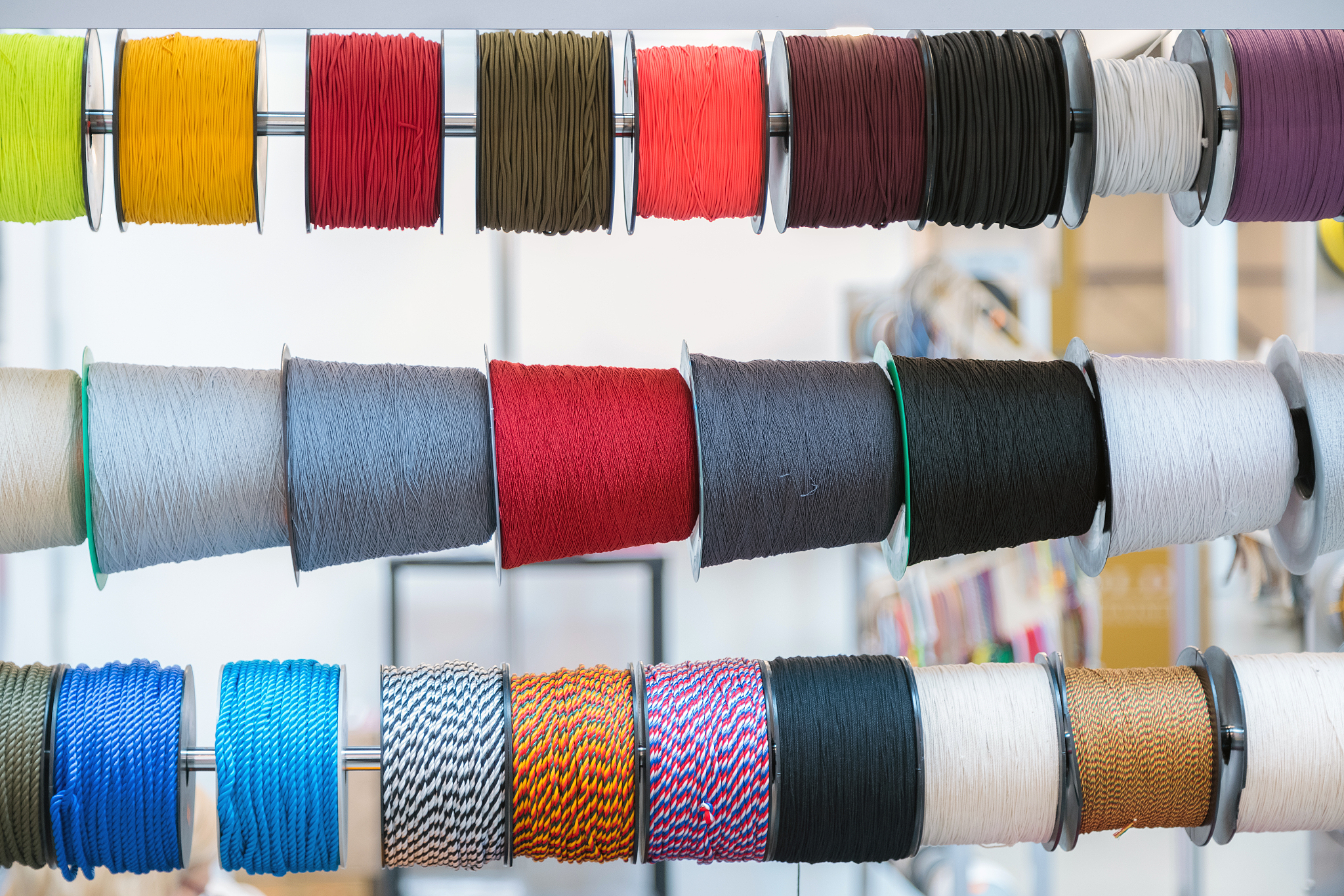 colourful embroidery thread spool using in garment industry, row