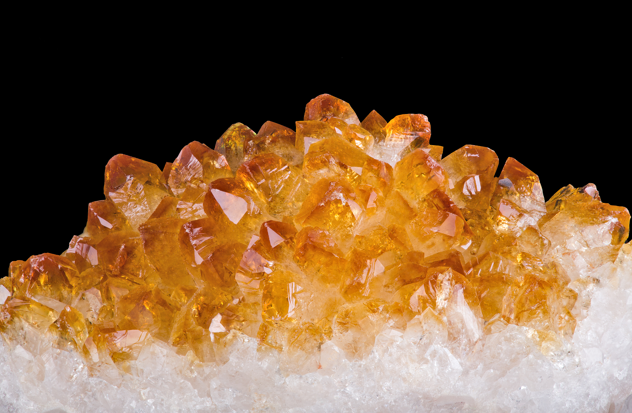 bright yellow citrine crystals on black