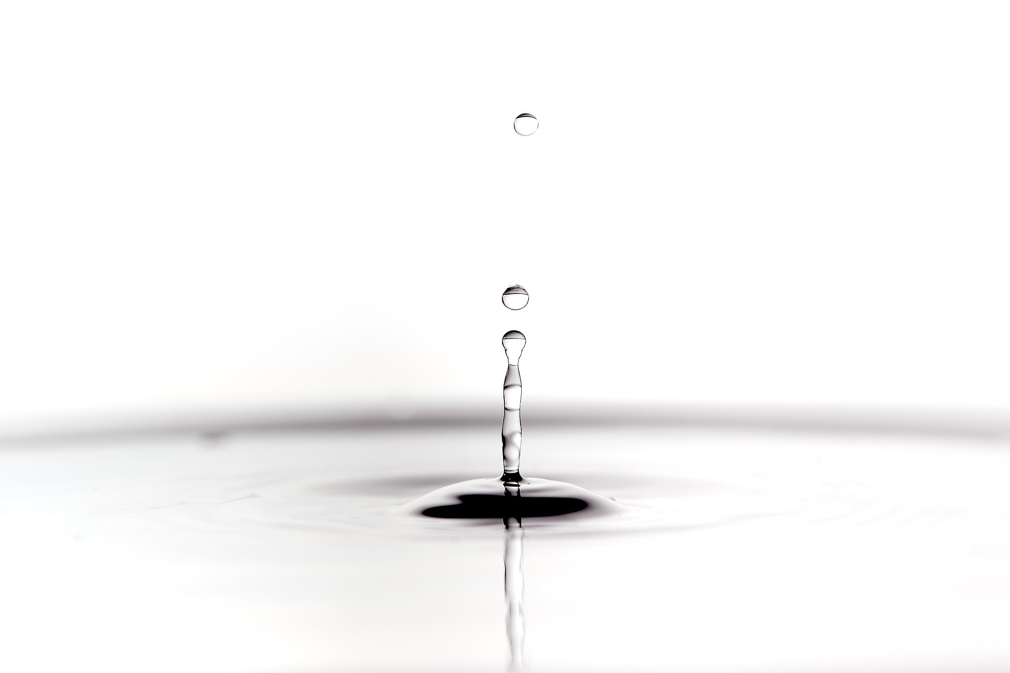 water drop falling in black and white