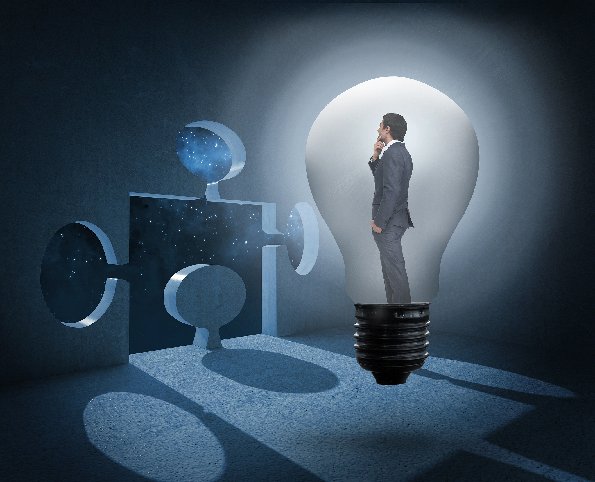 thinking businessman in light bulb against jigsaw door in dark r