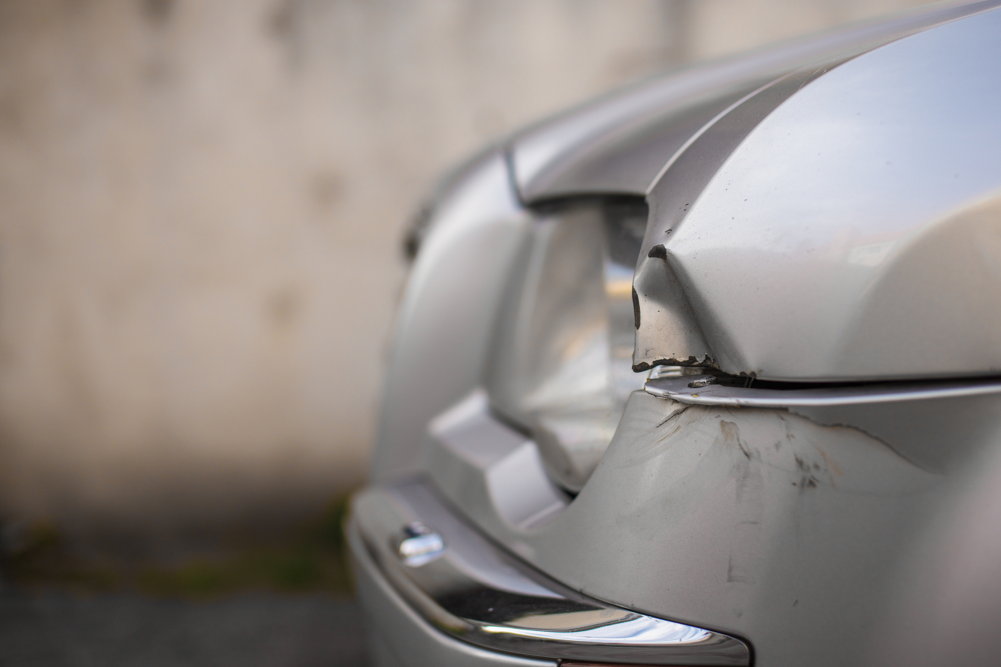car damged and dented in an accident