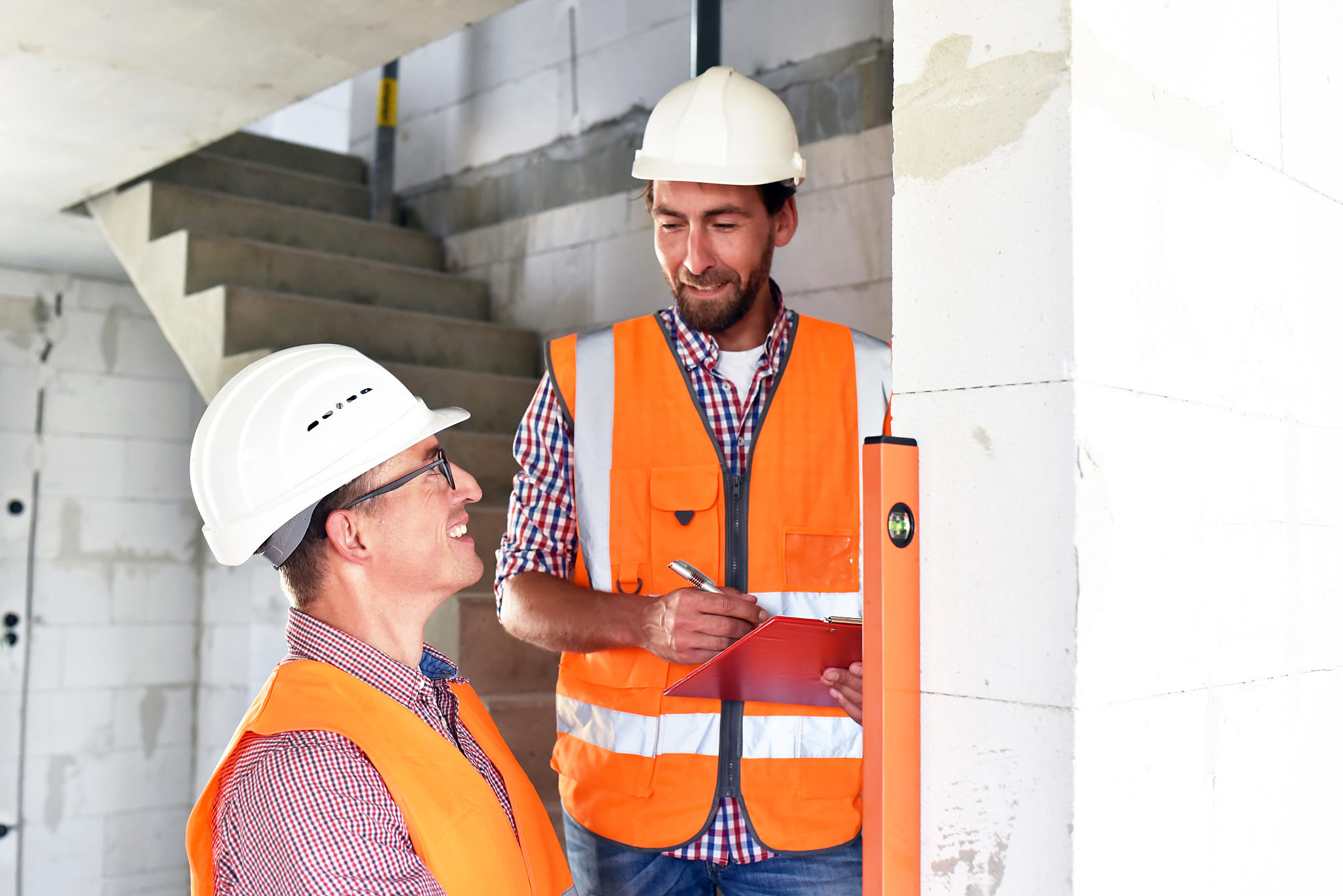 teamwork on the construction site - site manager and architect o