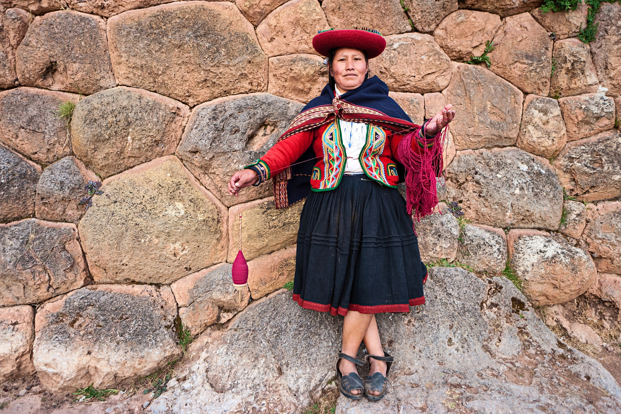 peruvian woman spinning wool, the sacred valley, chinchero