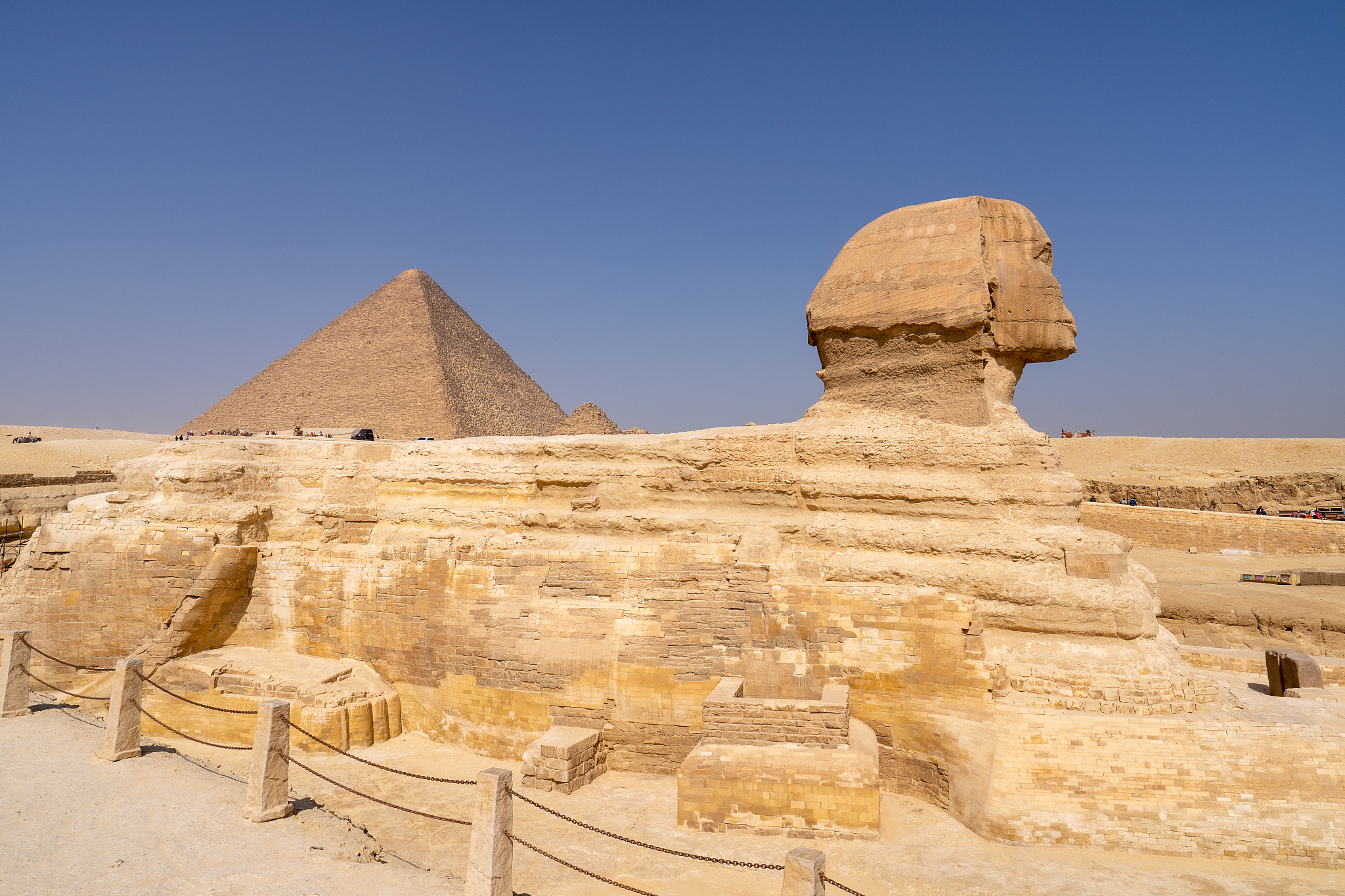 great sphinx of giza, with the great pyramid in the background