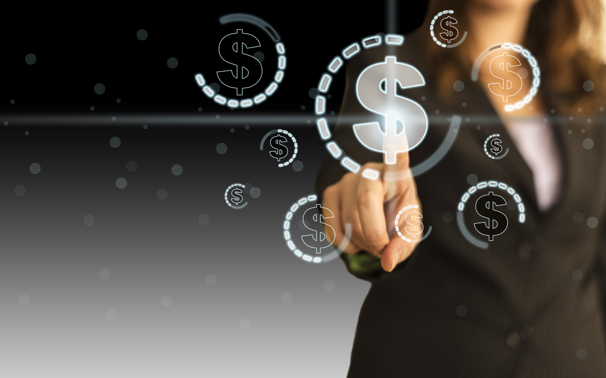 businesswoman pressing dollar symbol