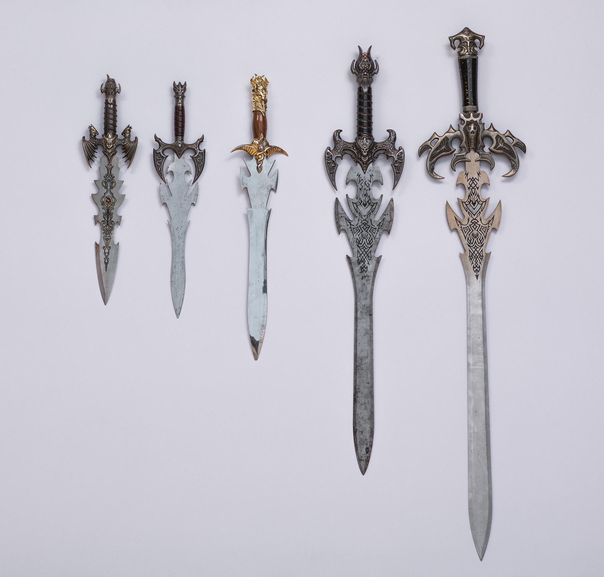 collection of medieval swords, knives and daggers