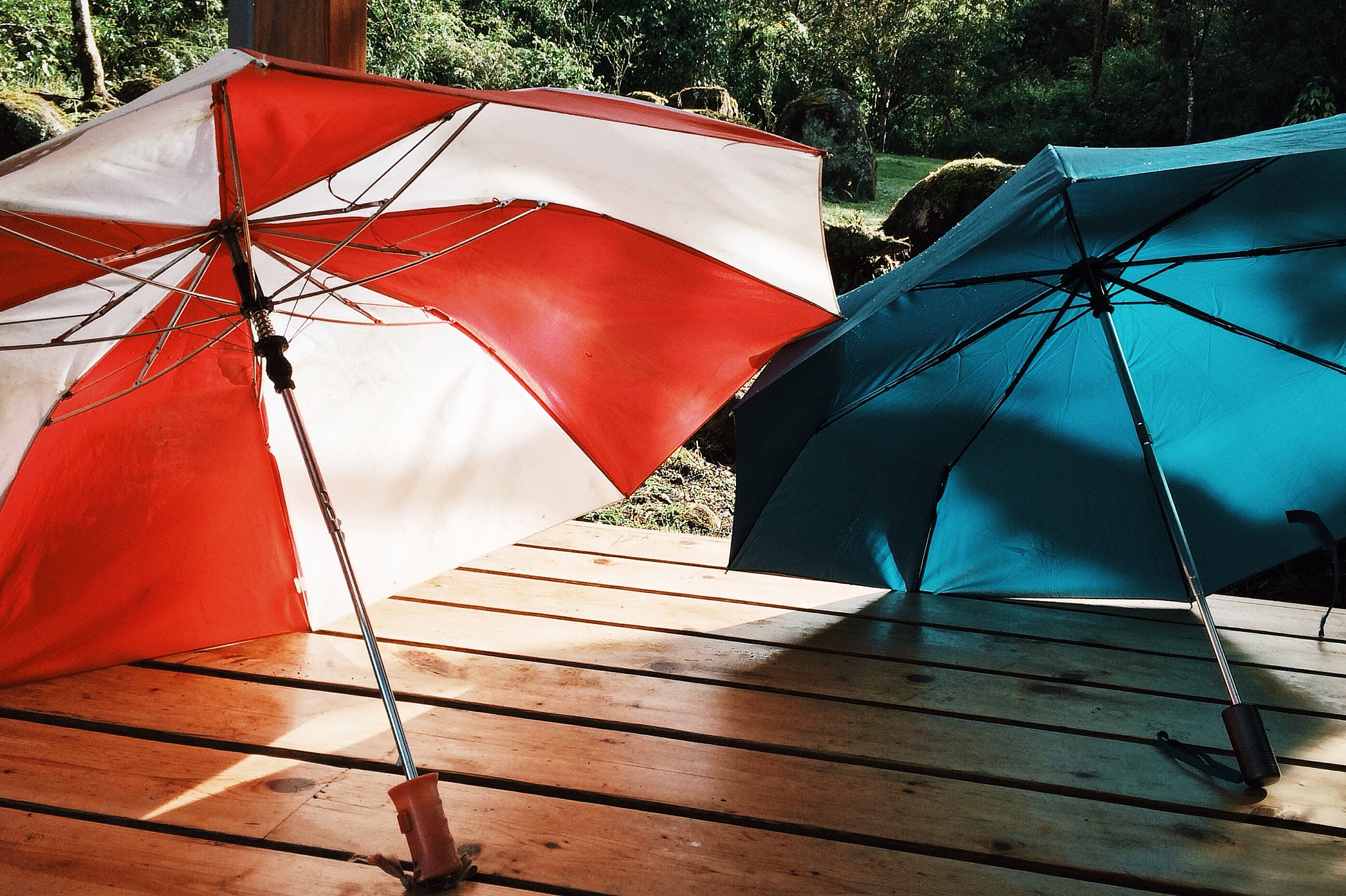open umbrellas on pier