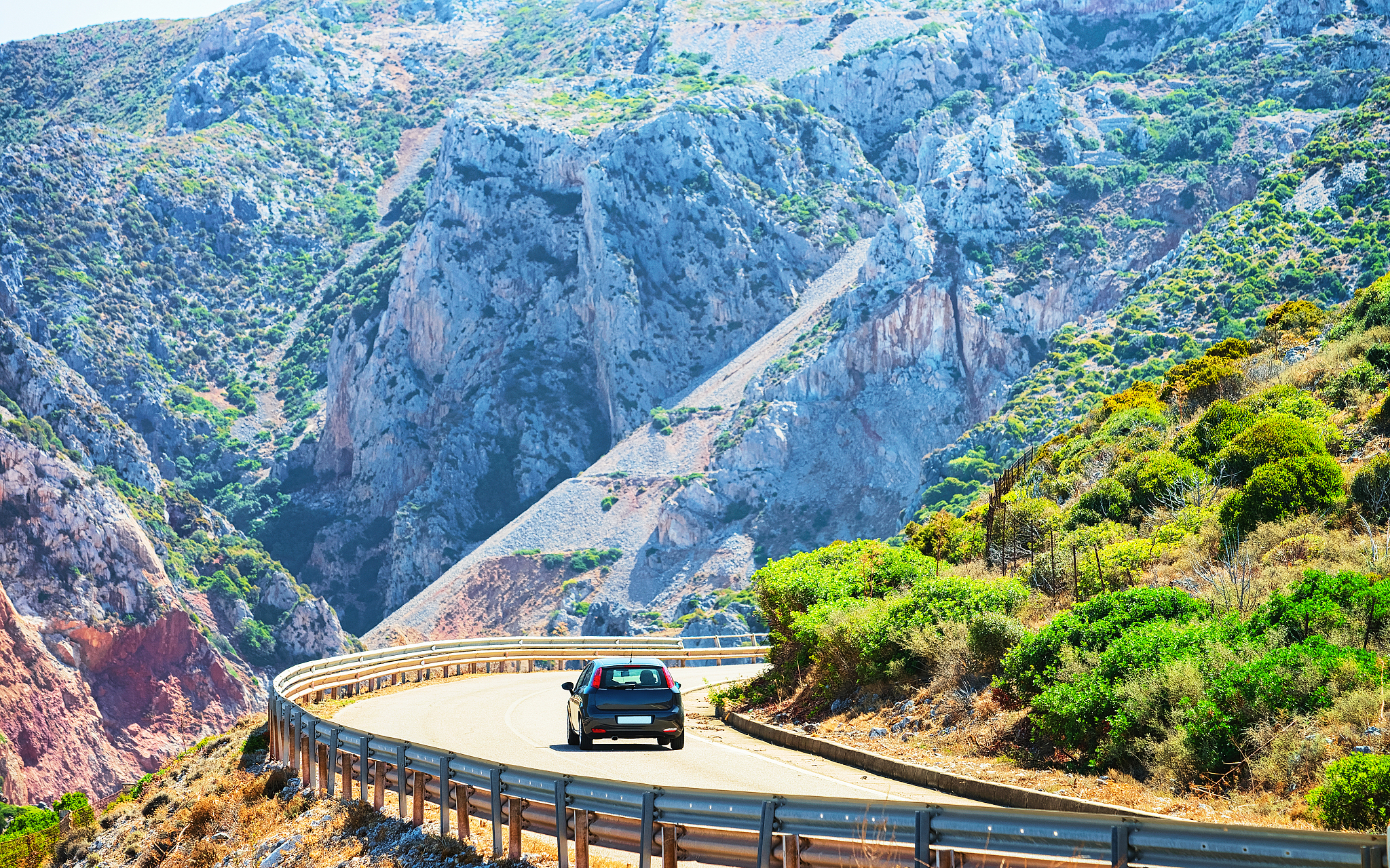 car on road at buggerru in carbonia iglesias sardinia