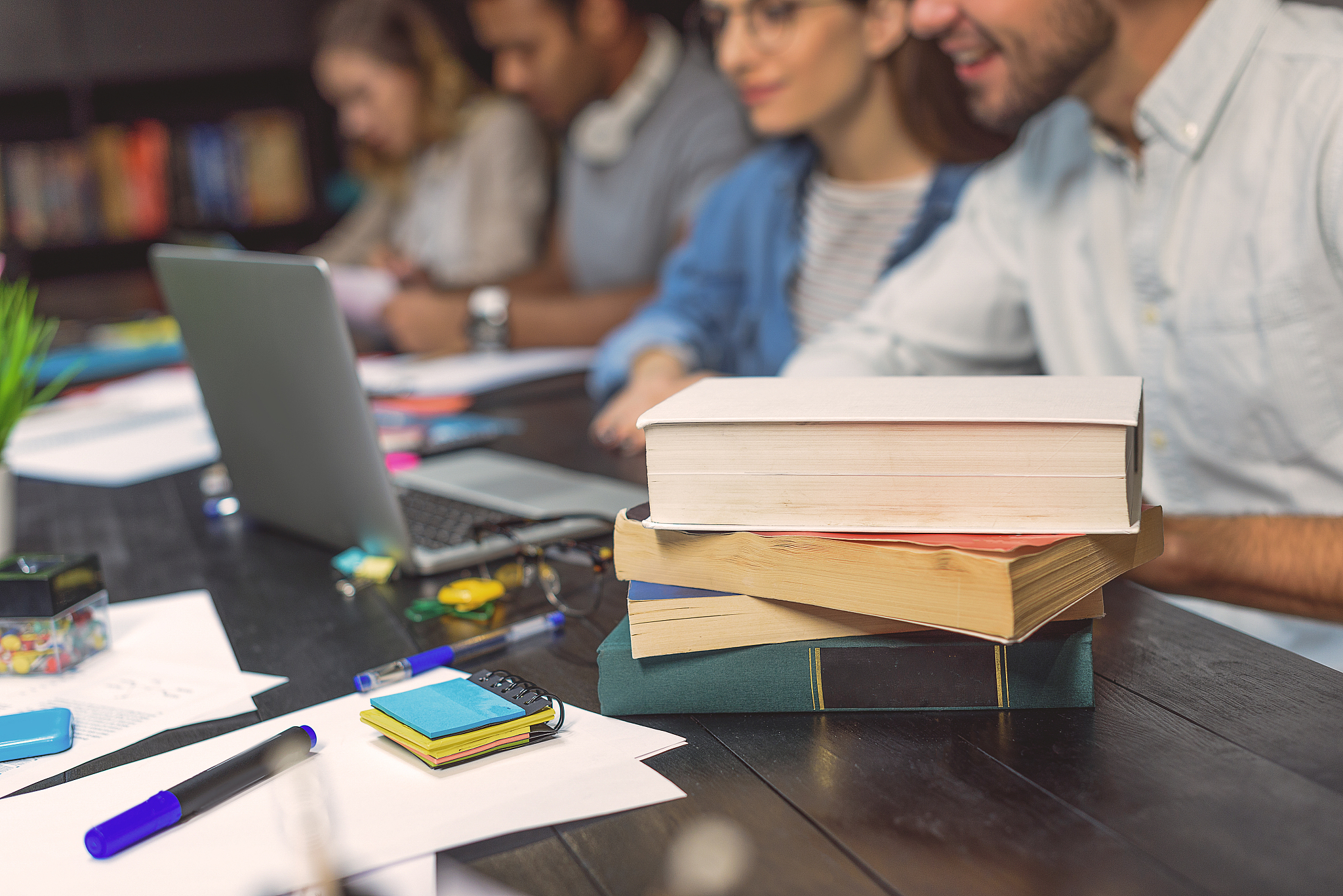 college students sitting together and studying