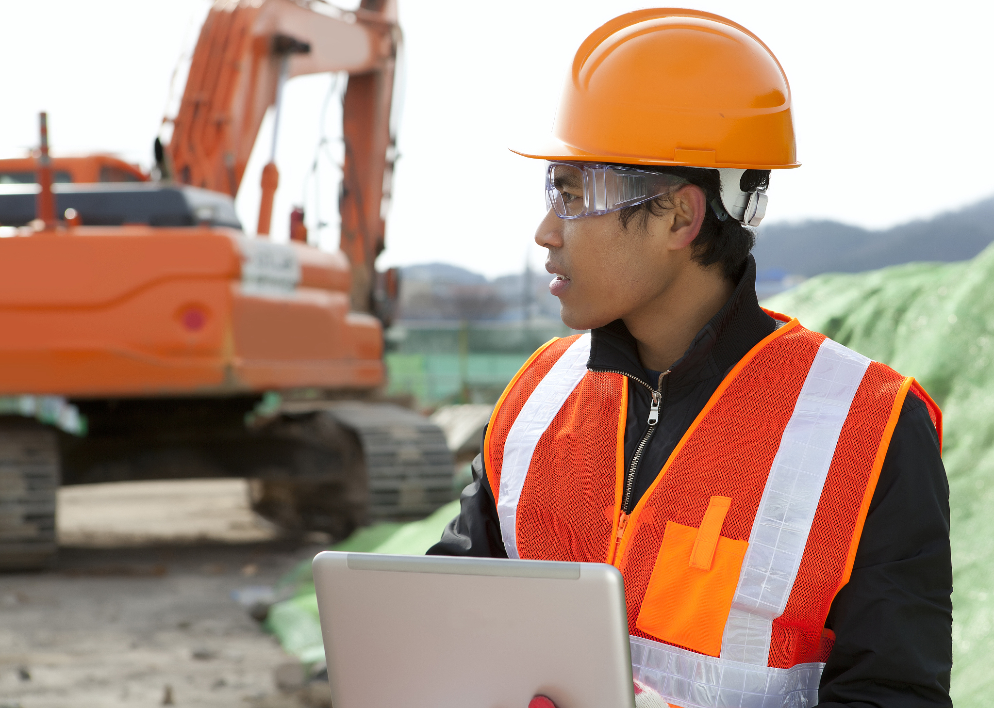construction worker and excavator
