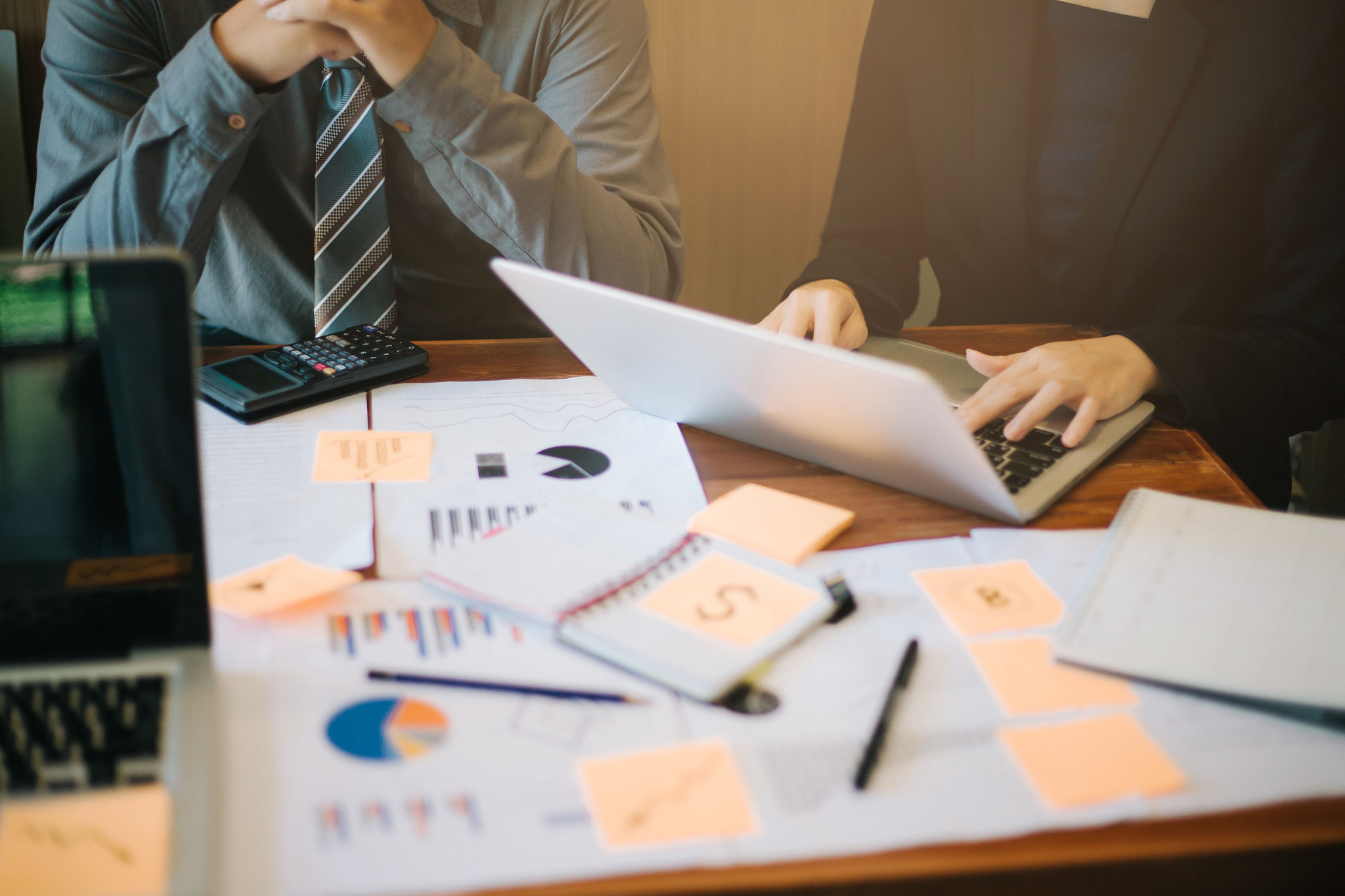 midsection of people working in office