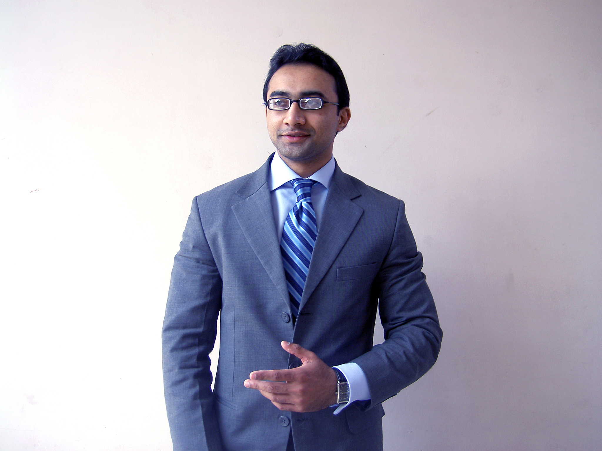 young man smiling in business suit