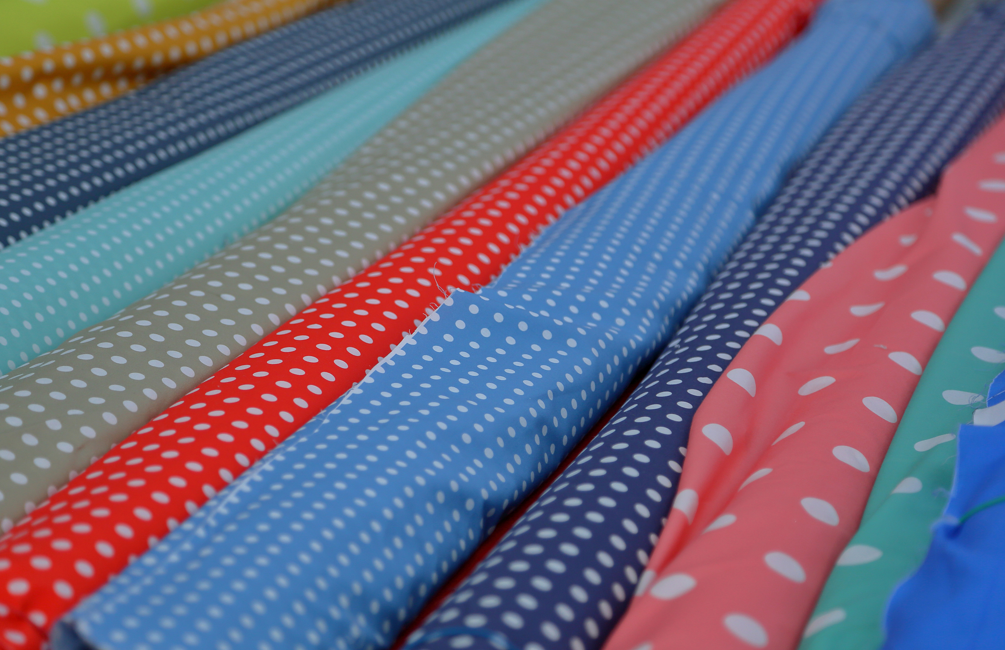 multicolored fabrics in rolls
