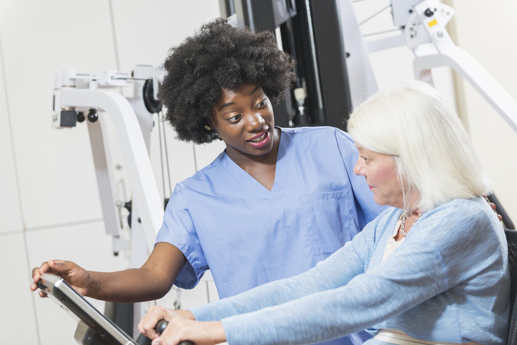 african american physical therapist working with patient