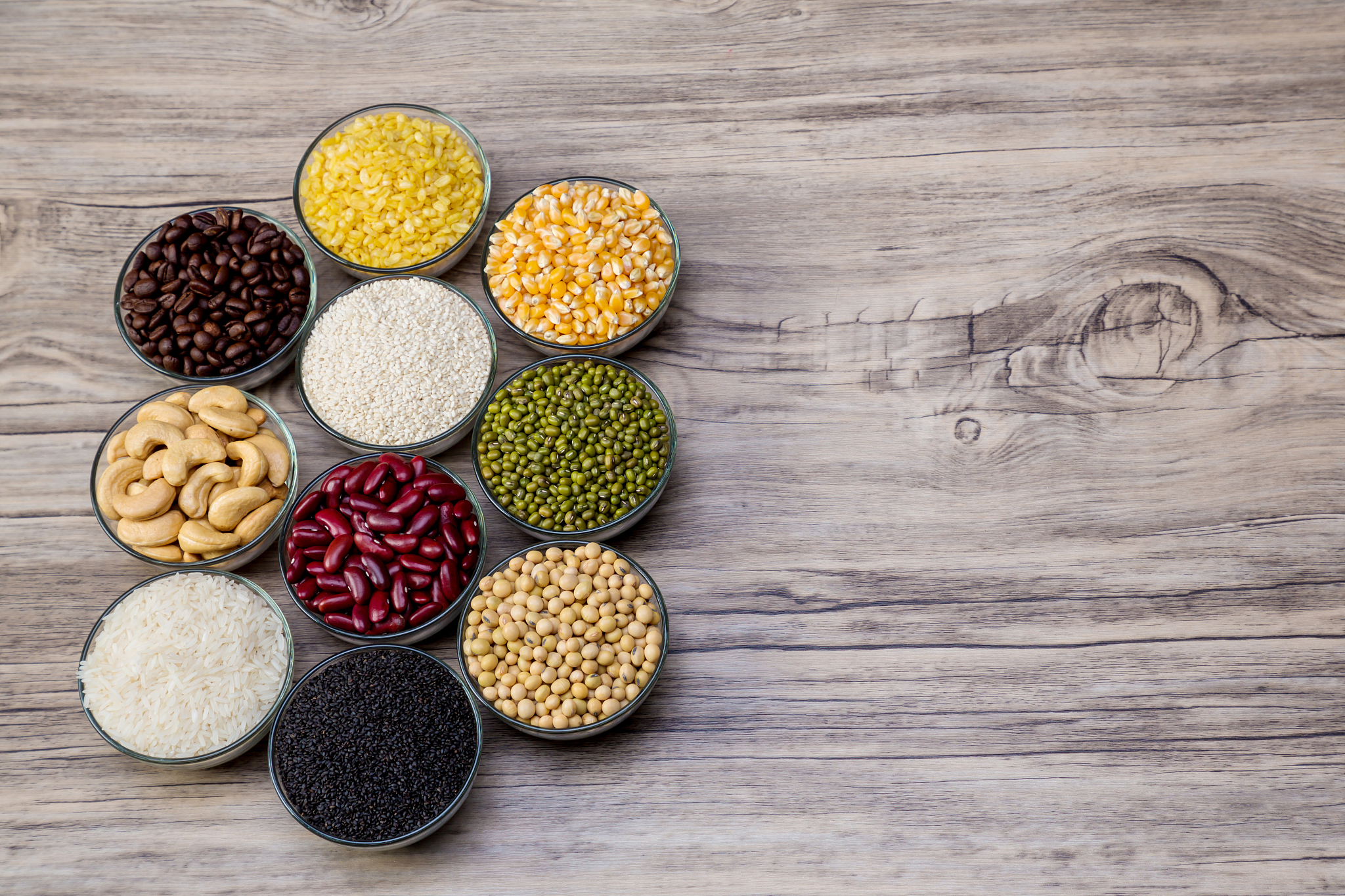 cereal grains seeds beans on wooden background. whole grains and