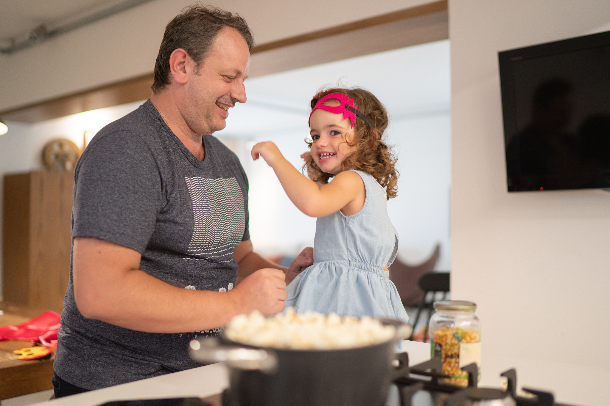 father and daughter dancing and having fun at home