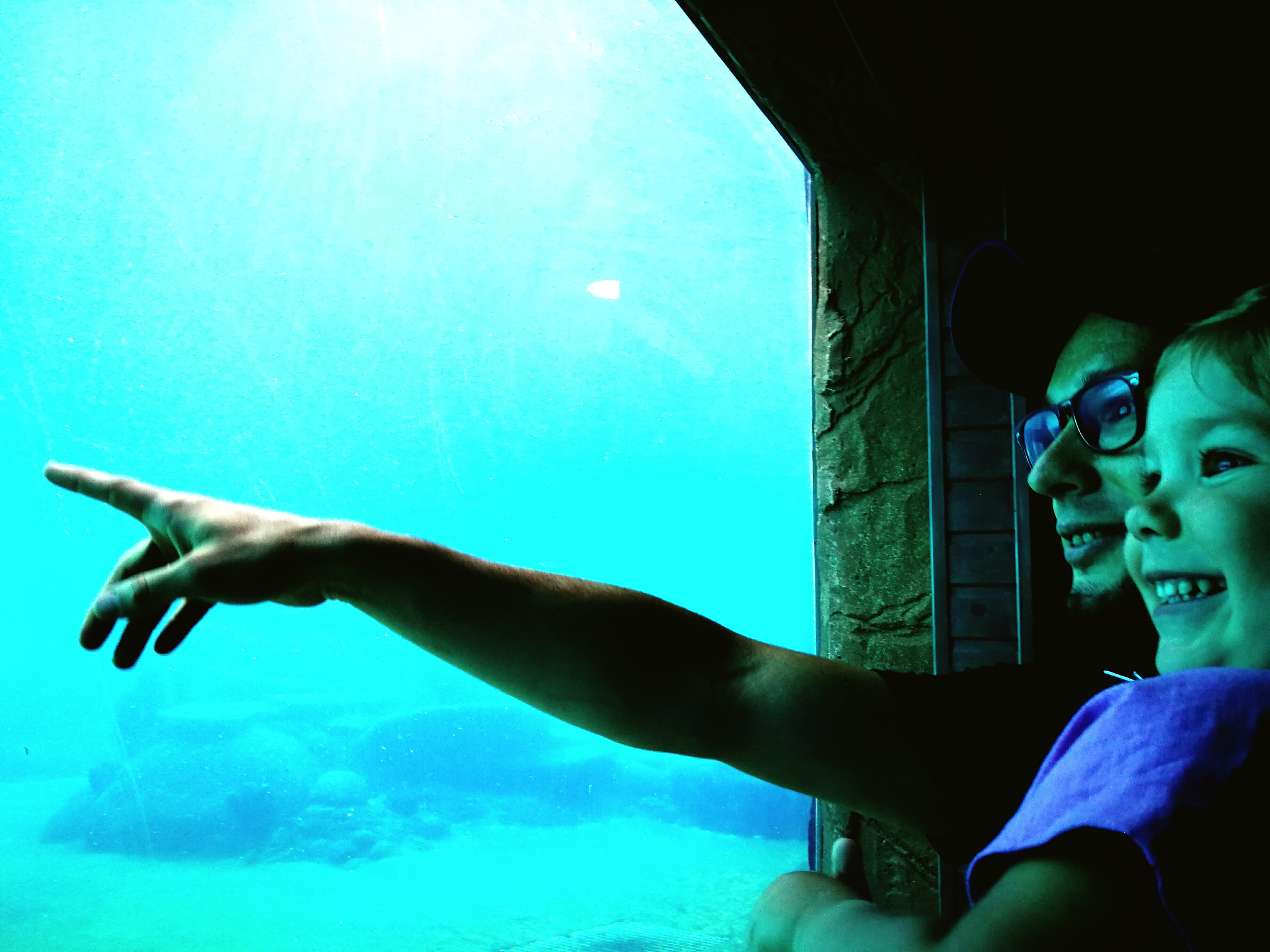 close-up of man with daughter at aquarium