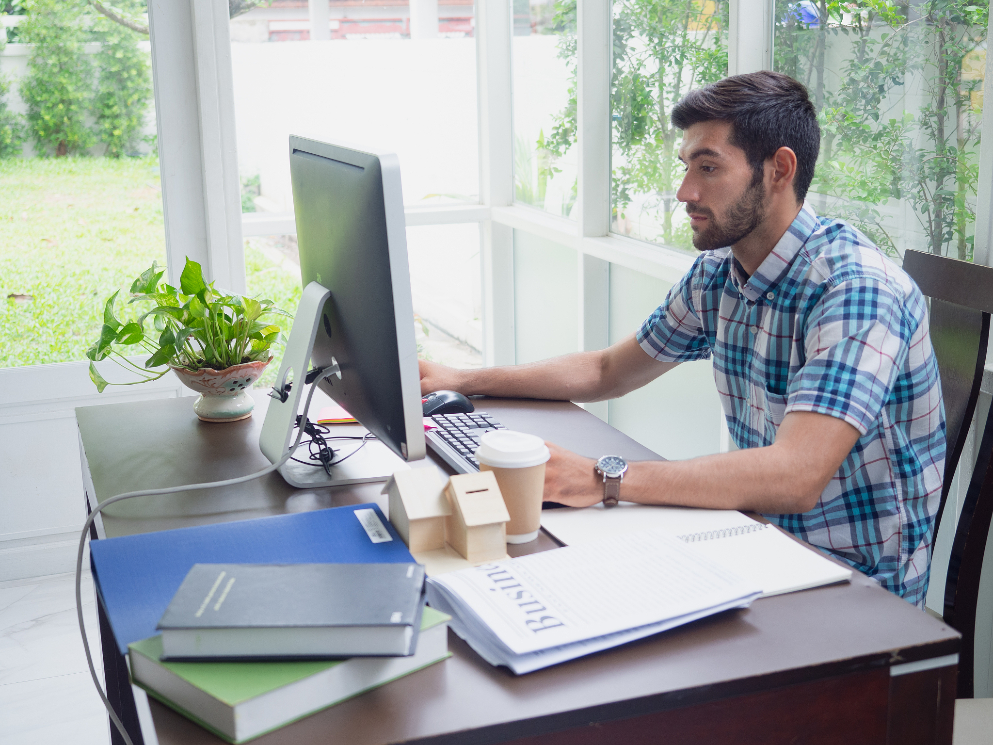 young man working at home ,businessman works on his computer to 