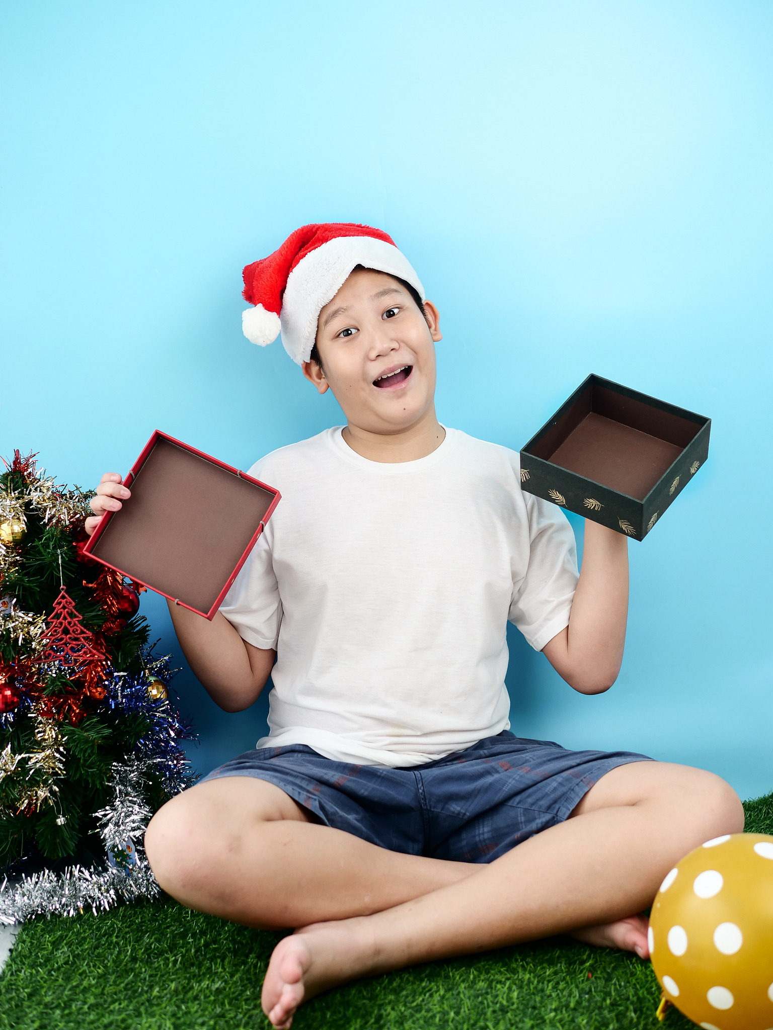 asian preteen boy red blank gift box with christmas concept.