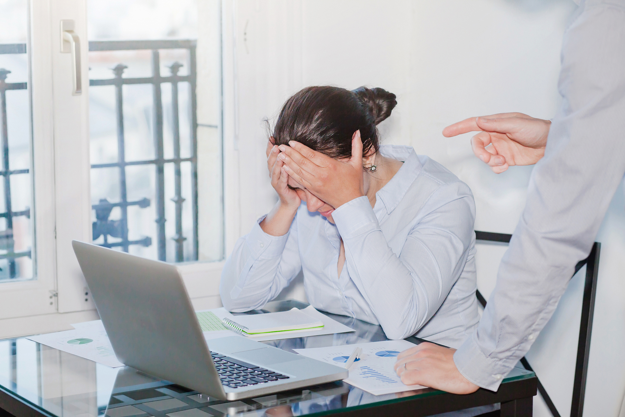 angry boss and stressed employee in the office